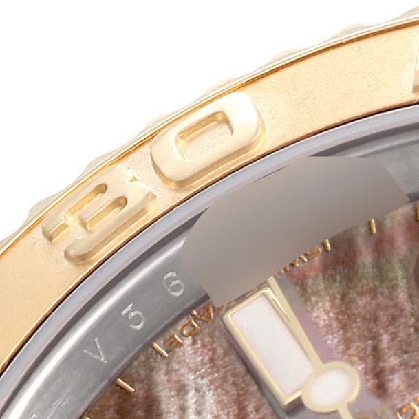 This image shows a close-up of the bezel and dial of a Rolex Yacht-Master 16623 Men's Steel and Gold (two tone) Mother of Pearl Dial 16623 Men's Steel and Gold (two tone) Mother of Pearl Dial watch.