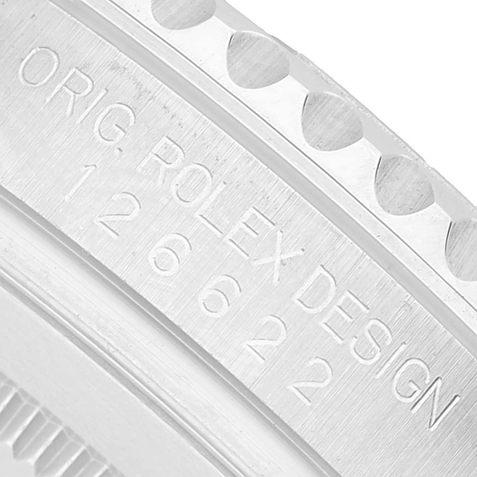 The image shows a close-up of the side of the Rolex Yacht-Master 126622 Men's Stainless Steel Blue Dial, highlighting the engraved model number and design text.