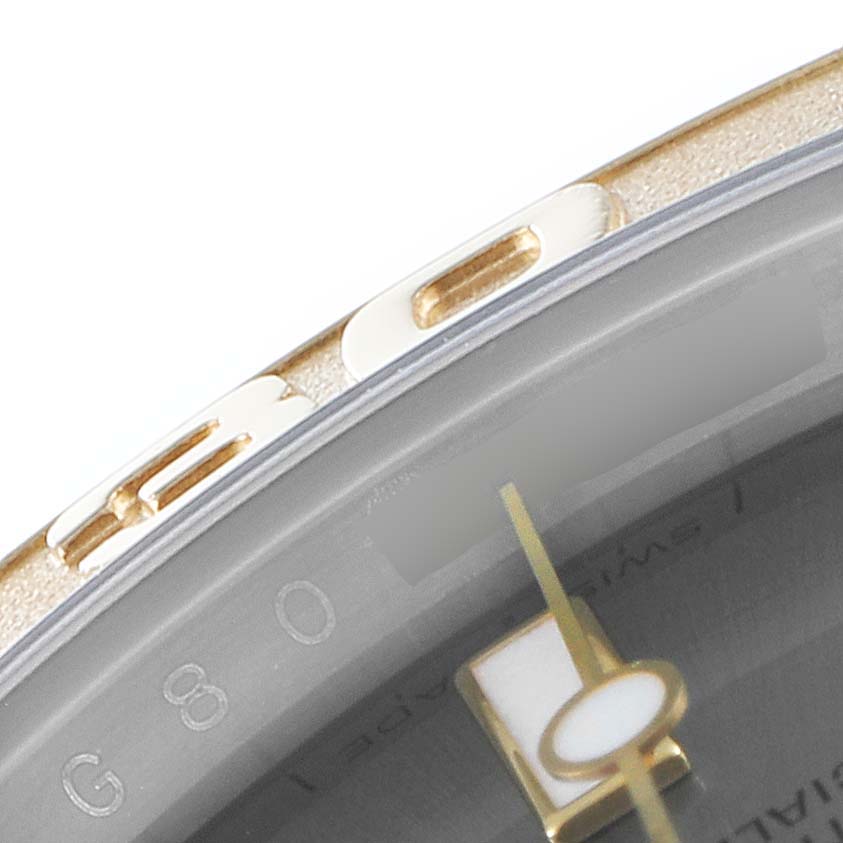 The image shows a close-up of the bezel and part of the dial of a Rolex Yacht-Master 16623 Men
s Steel and Gold (two tone) Grey Dial 16623 Men
s Steel and Gold (two tone) Grey Dial watch.
