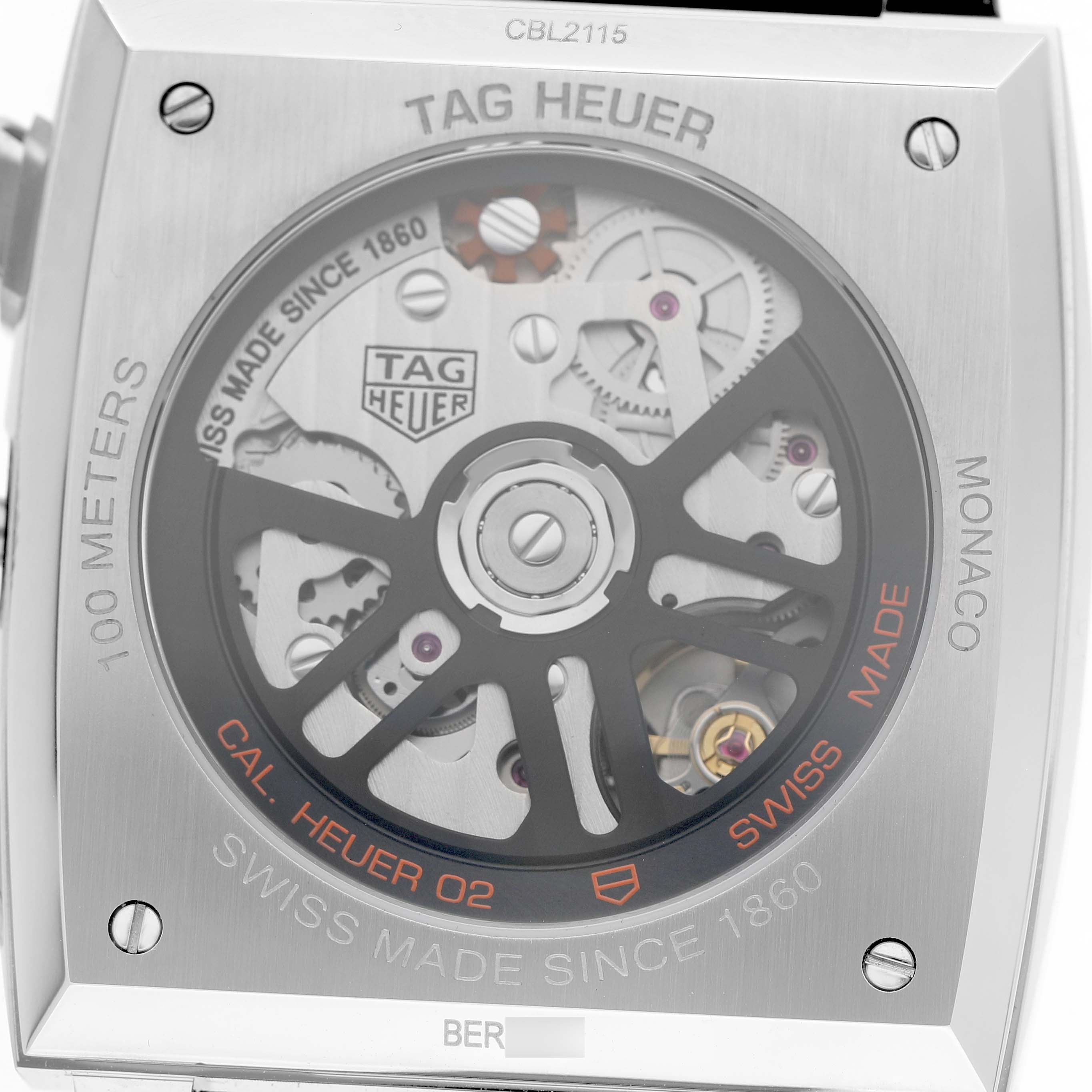 The image shows the back of the Tag Heuer Monaco CBL2115 Men's Stainless Steel Blue Dial watch displaying its mechanical movement and branding details.