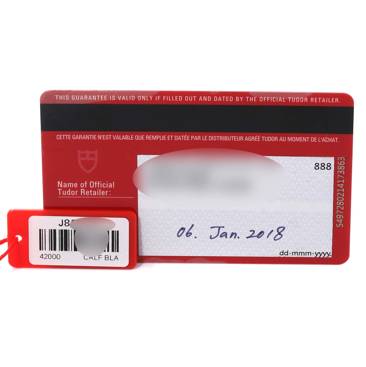 The image shows the warranty card and tag for the Tudor Fastrider 42000D Men's Stainless Steel Red Dial 42000D Men's Stainless Steel Red Dial model from a top-down angle.