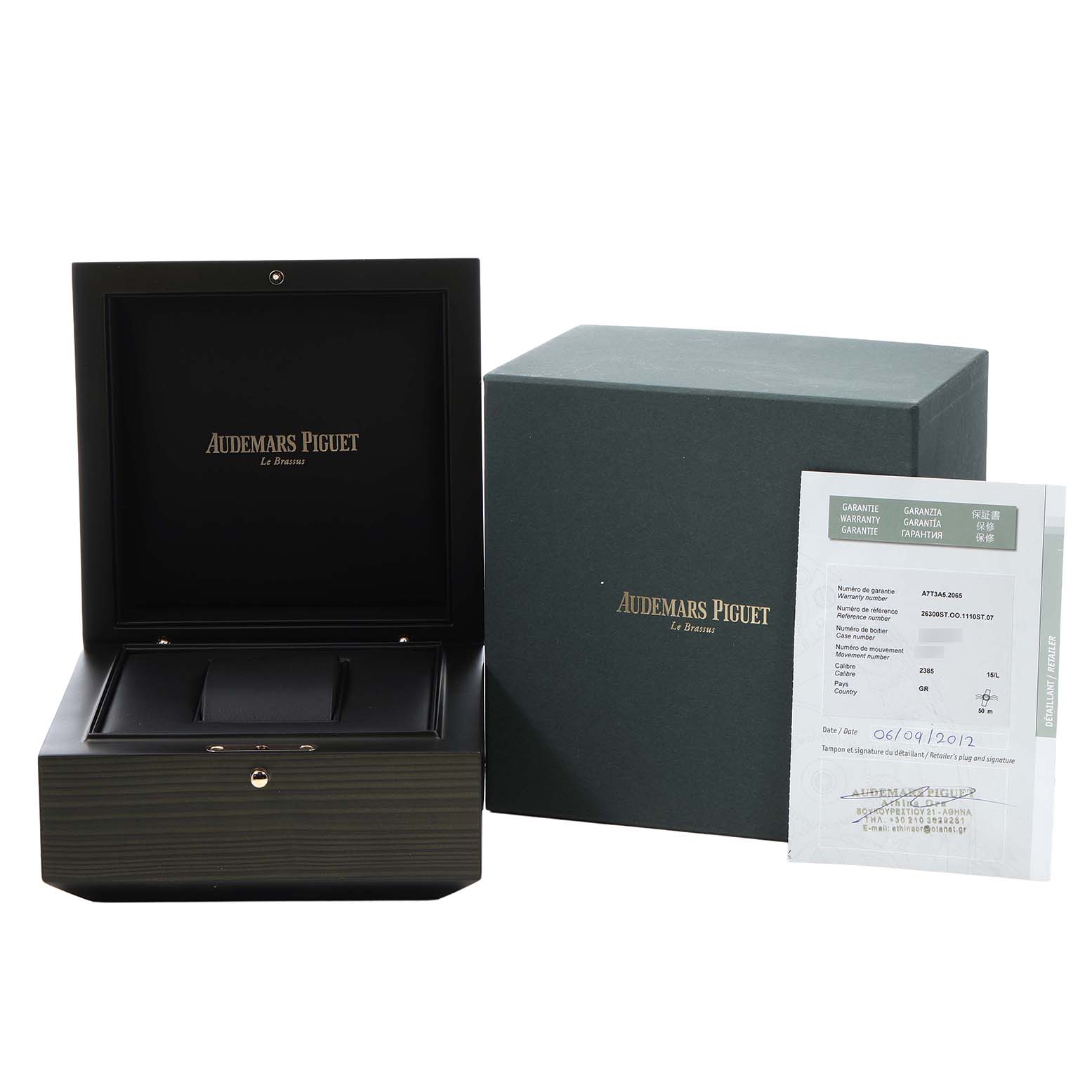 The image shows the opened box, outer box, and certificate for an Audemars Piguet Royal Oak 26300ST.OO.1110ST.07 Men's Stainless Steel Blue Dial watch.