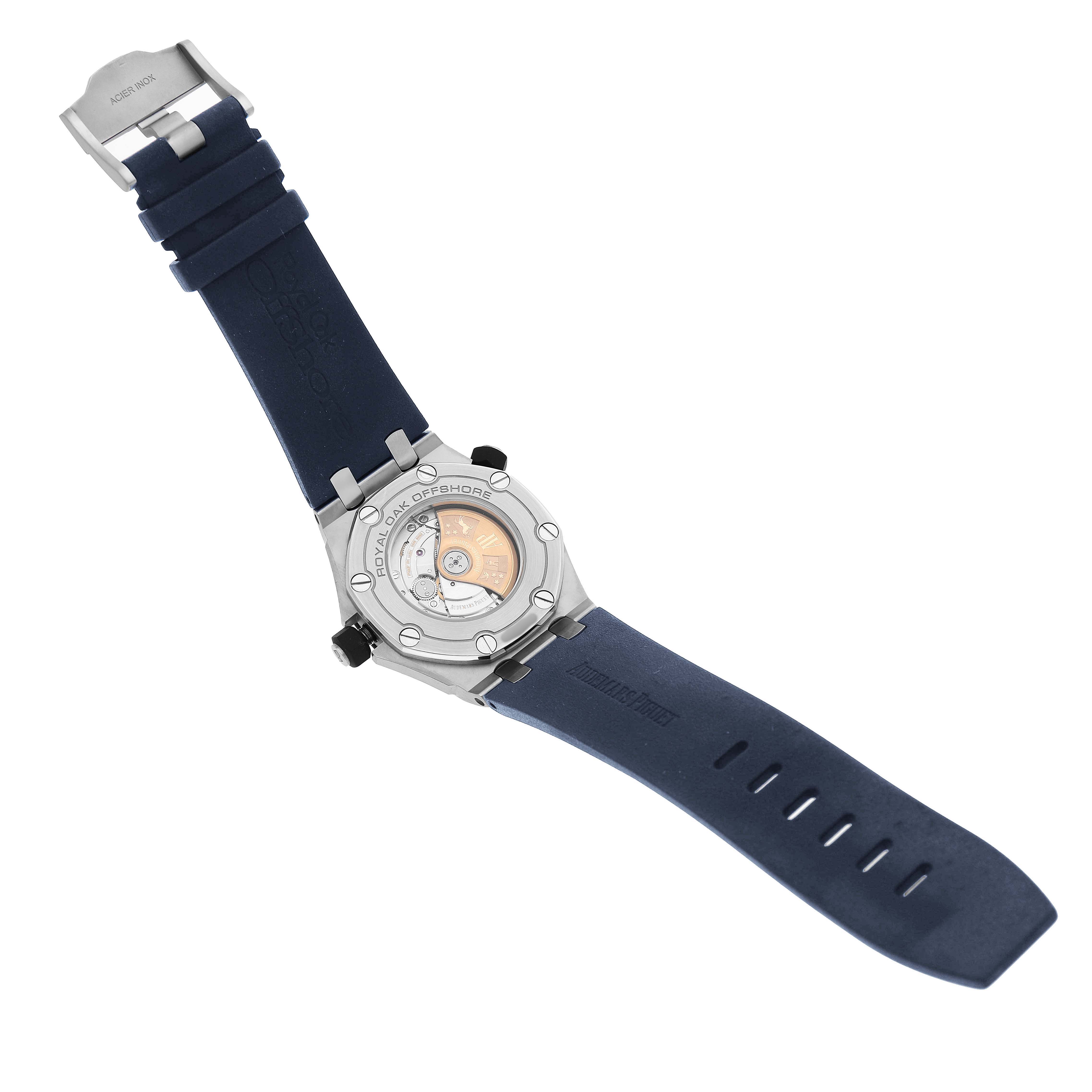 The image shows the back of an Audemars Piguet Royal Oak Offshore 15710ST.00.A027CA.01 Men's Stainless Steel Blue Dial watch, highlighting its open case back and blue strap.