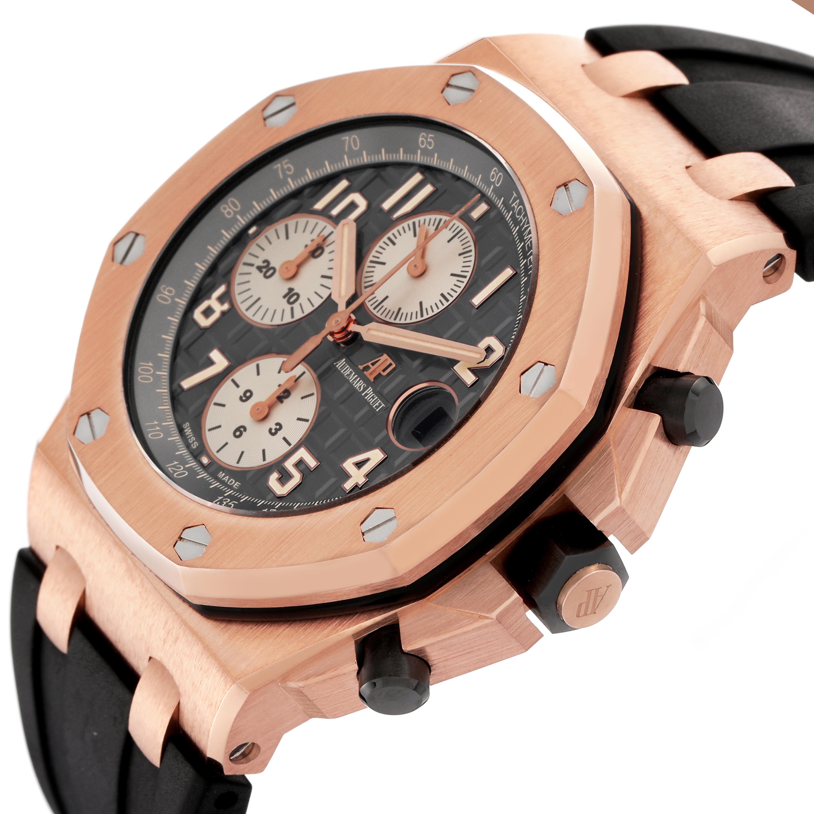 The Audemars Piguet Royal Oak Offshore 26470OR.OO.A125CR.01.A Men's Rose Gold Grey Dial 26470OR.OO.A125CR.01.A Men's Rose Gold Grey Dial watch is shown at a slight angle, highlighting its rose gold case, black dial, and rubber strap.