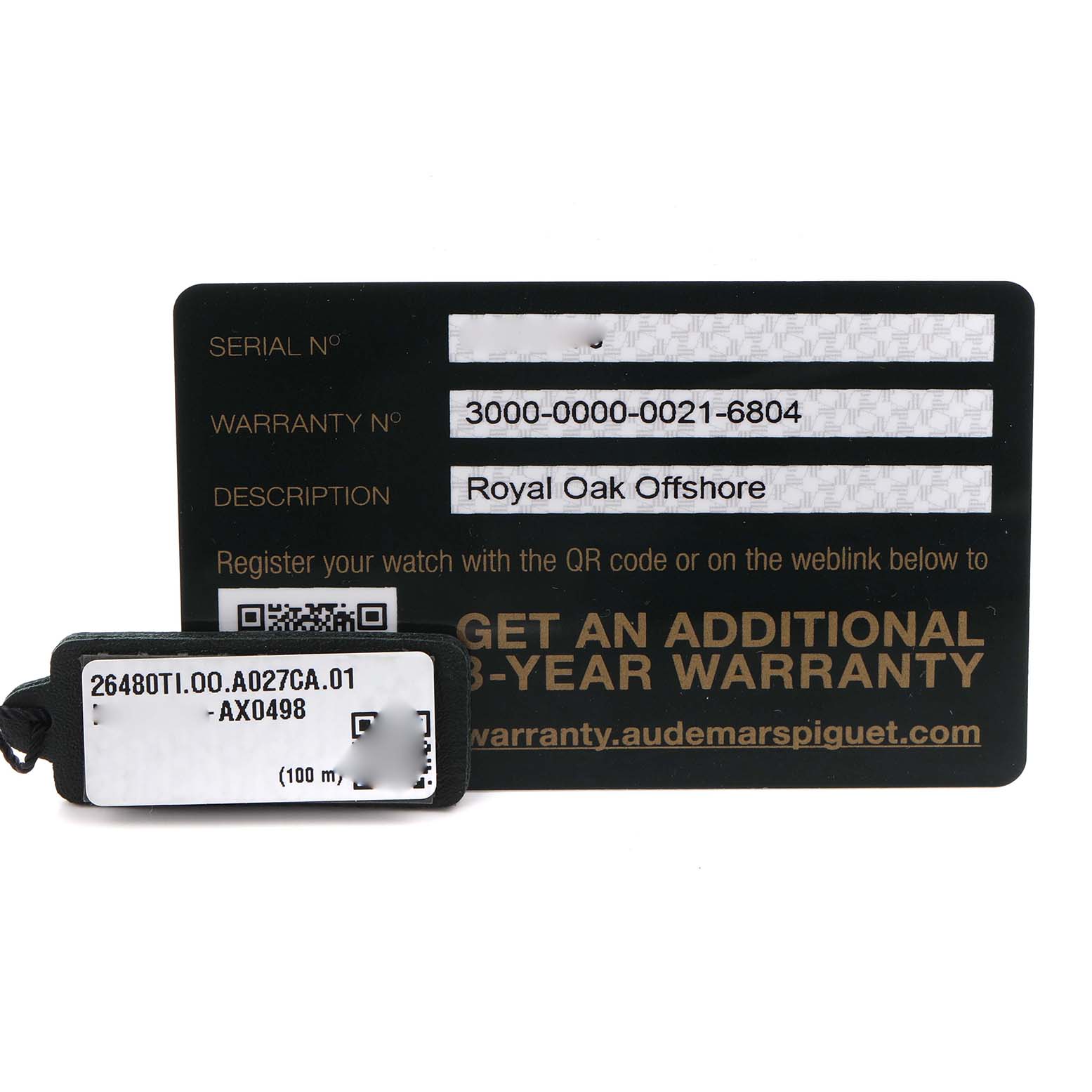 The image shows a warranty card and tag for the Audemars Piguet Royal Oak Offshore 26480TI.OO.A027CA.01 Men's Titanium Blue Dial 26480TI.OO.A027CA.01 Men's Titanium Blue Dial watch.