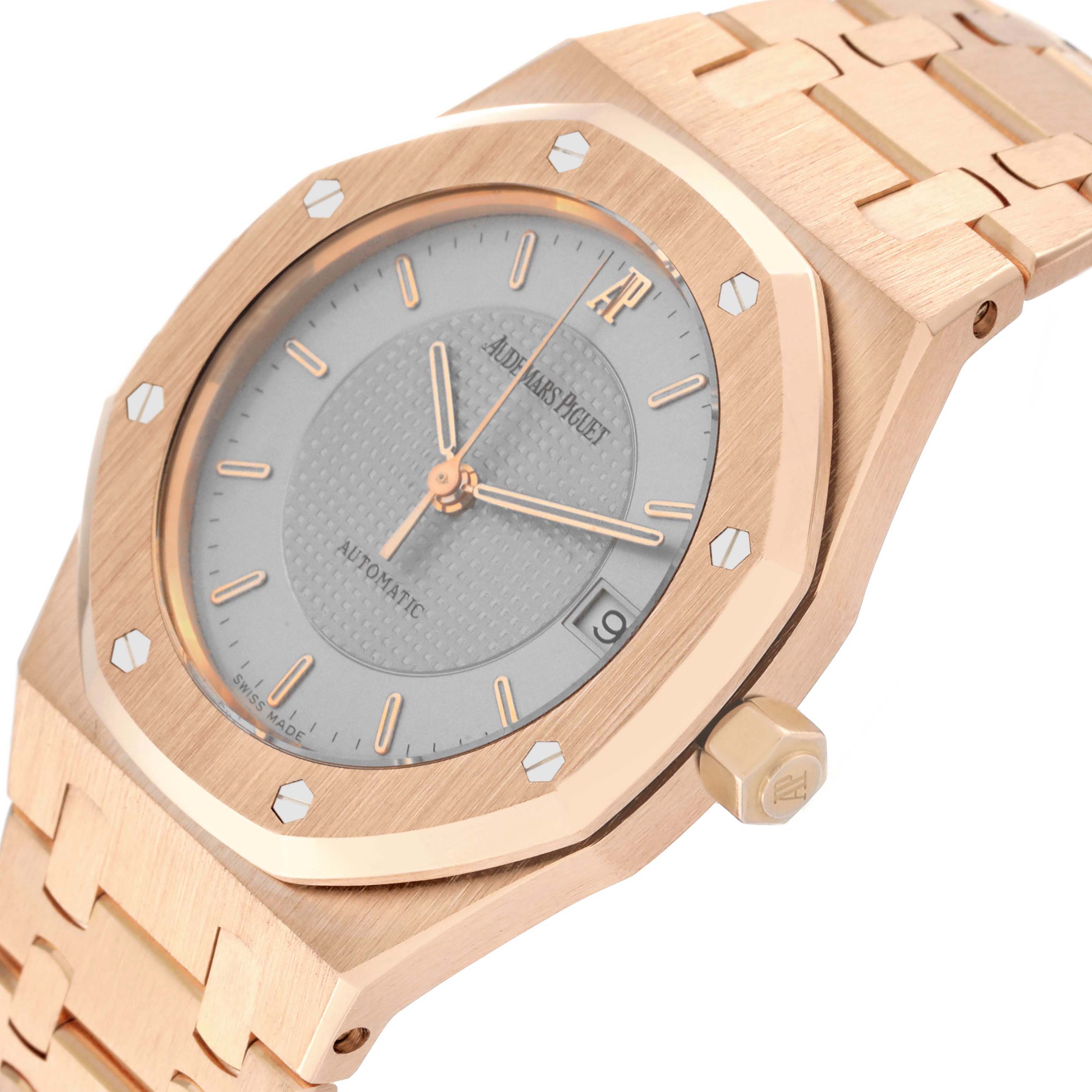 This image shows a close-up angled shot of the face, bezel, crown, and part of the bracelet of the Audemars Piguet Royal Oak 15097OR.O.0789OR.01 Men's Rose Gold Silver Dial 15097OR.O.0789OR.01 Men's Rose Gold Silver Dial watch.