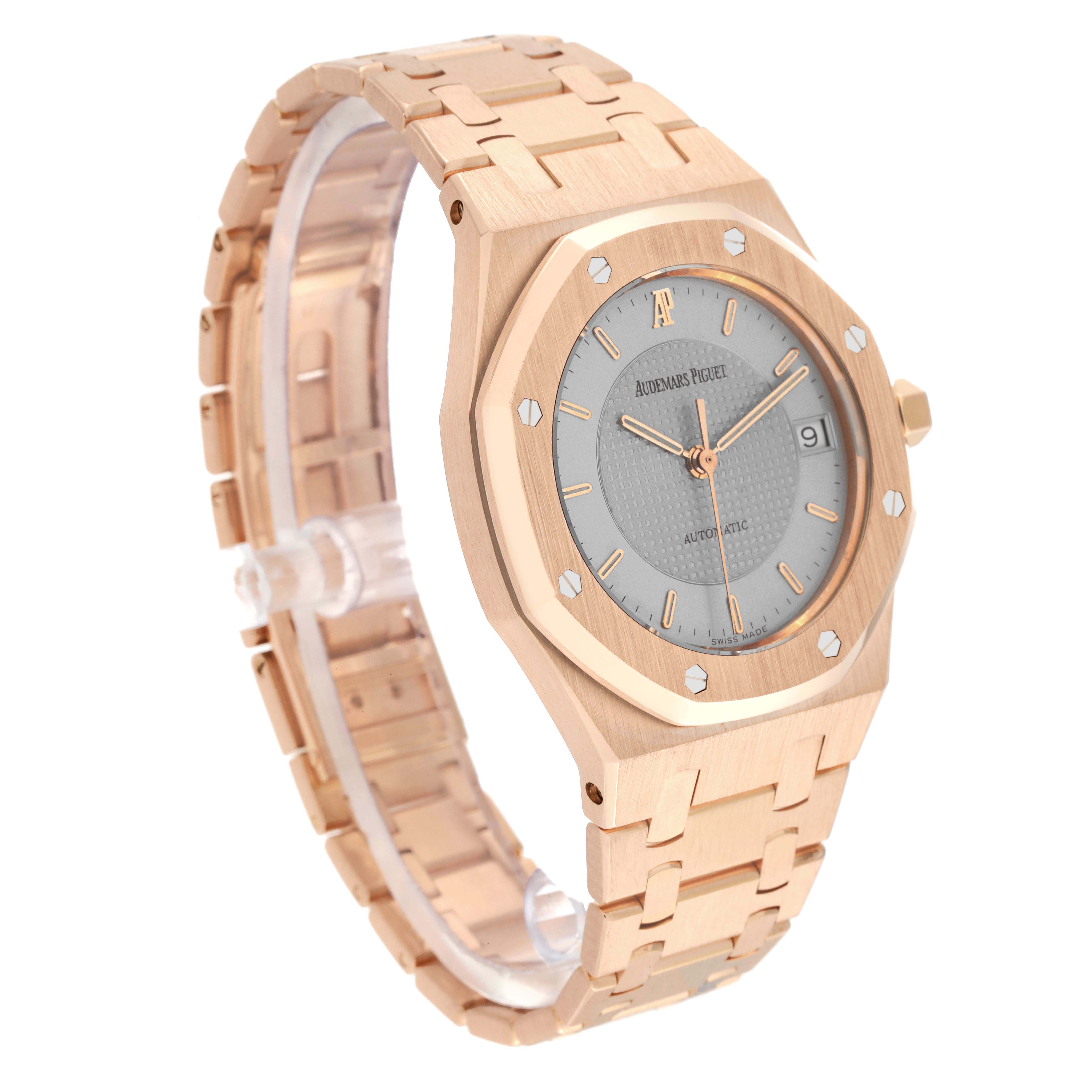 This image shows a side angle of the Audemars Piguet Royal Oak 15097OR.O.0789OR.01 Men's Rose Gold Silver Dial 15097OR.O.0789OR.01 Men's Rose Gold Silver Dial watch, highlighting its rose gold bracelet, case, and grey dial.