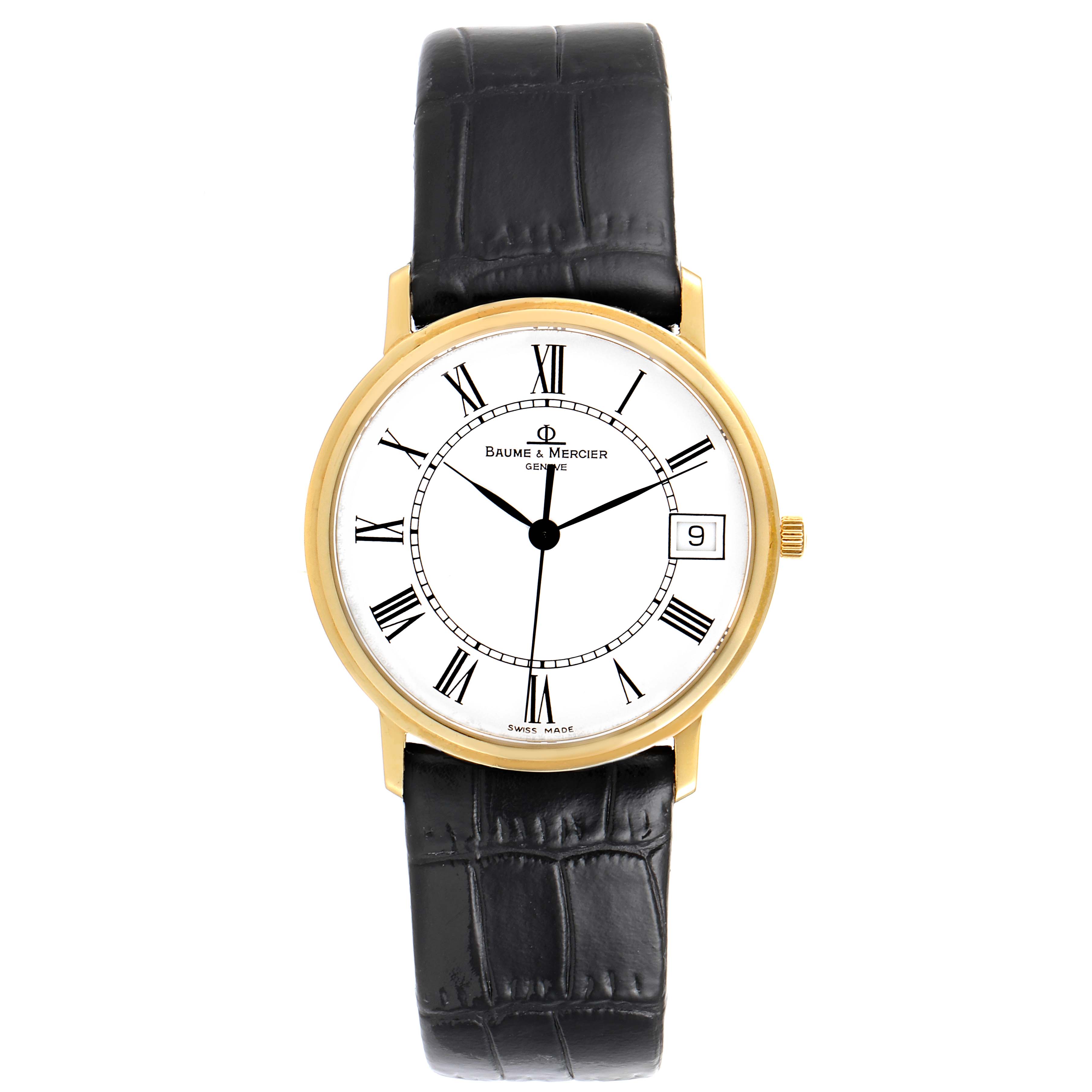 This image shows a frontal view of a Baume & Mercier Classima MV045093 Men's Yellow Gold White Dial MV045093 Men's Yellow Gold White Dial watch with a white dial, Roman numerals, date window, and black leather strap.