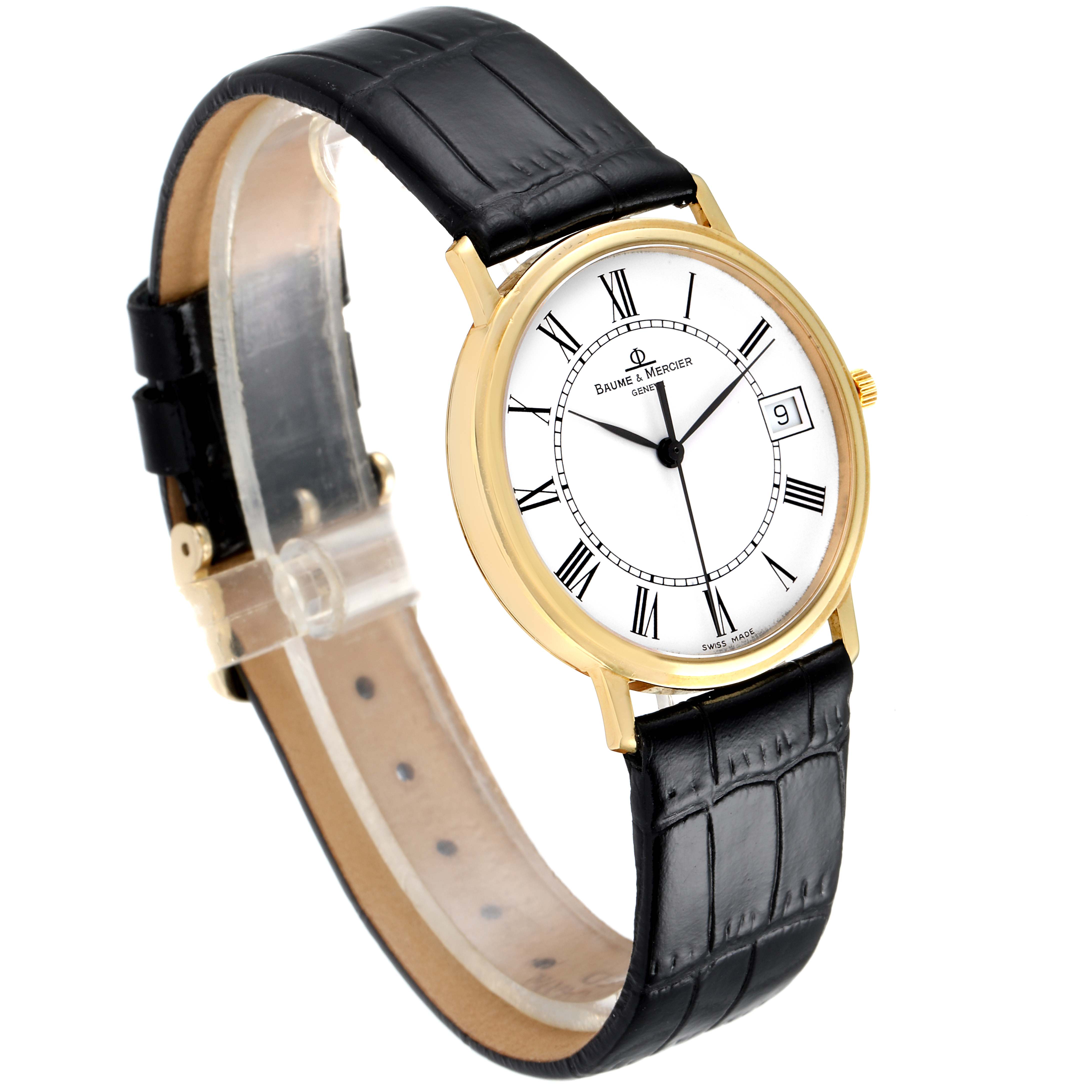 This angled view of the Baume & Mercier Classima MV045093 Men's Yellow Gold White Dial MV045093 Men's Yellow Gold White Dial watch shows the black leather strap, gold case, and white dial with Roman numerals.