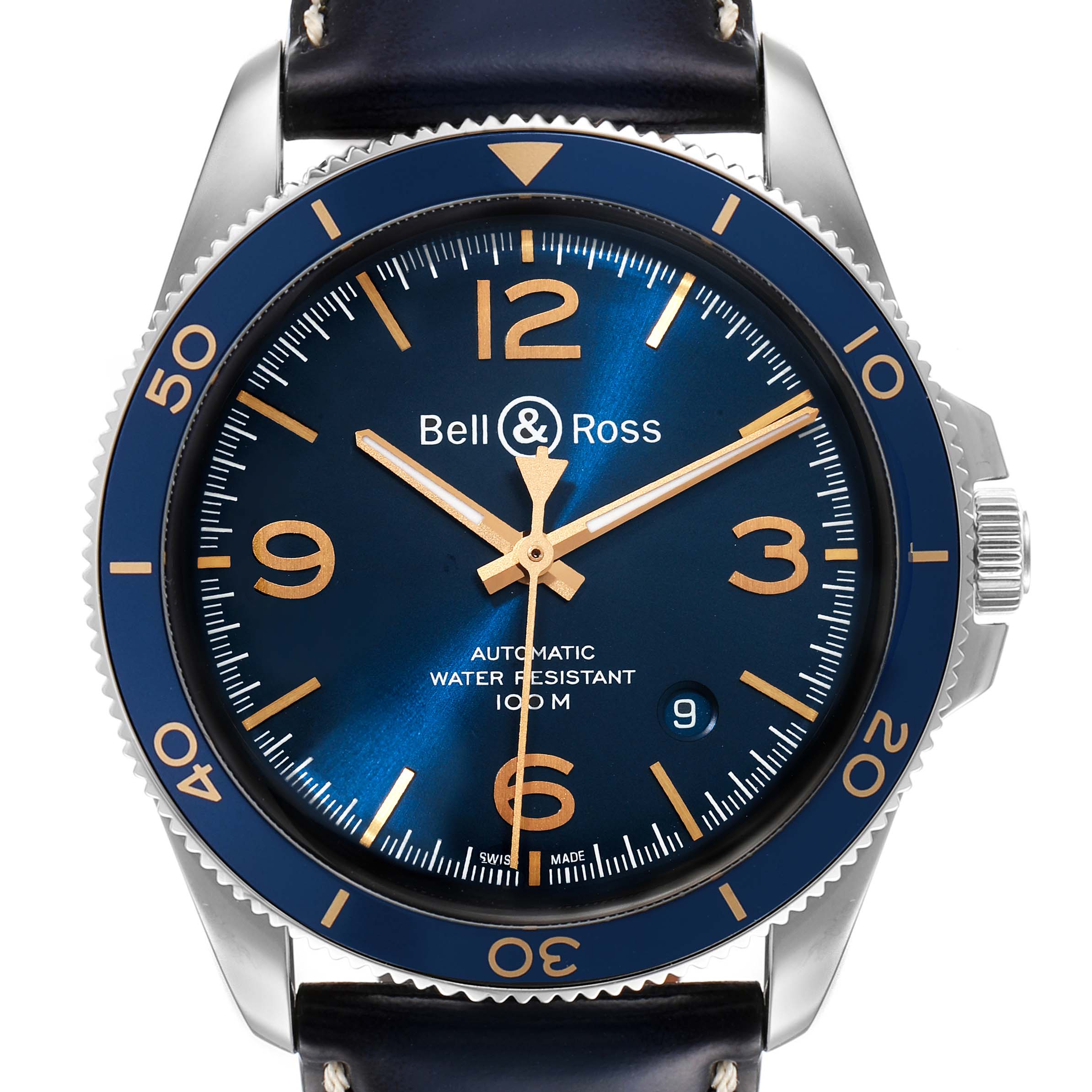 The image shows a front view of the Bell & Ross Heritage BRV292-BU-G-ST/SCA Men's Stainless Steel Blue Dial BRV292-BU-G-ST/SCA Men's Stainless Steel Blue Dial model watch with a blue dial and bezel, gold numerals, and a leather strap.