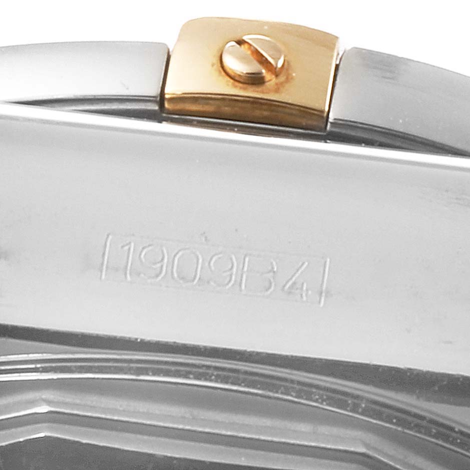 This close-up image shows the side of the clasp and part of the bracelet of a Breitling Chronomat IB0110 Men
s Stainless Steel Brown Dial IB0110 Men
s Stainless Steel Brown Dial watch, including a model number.