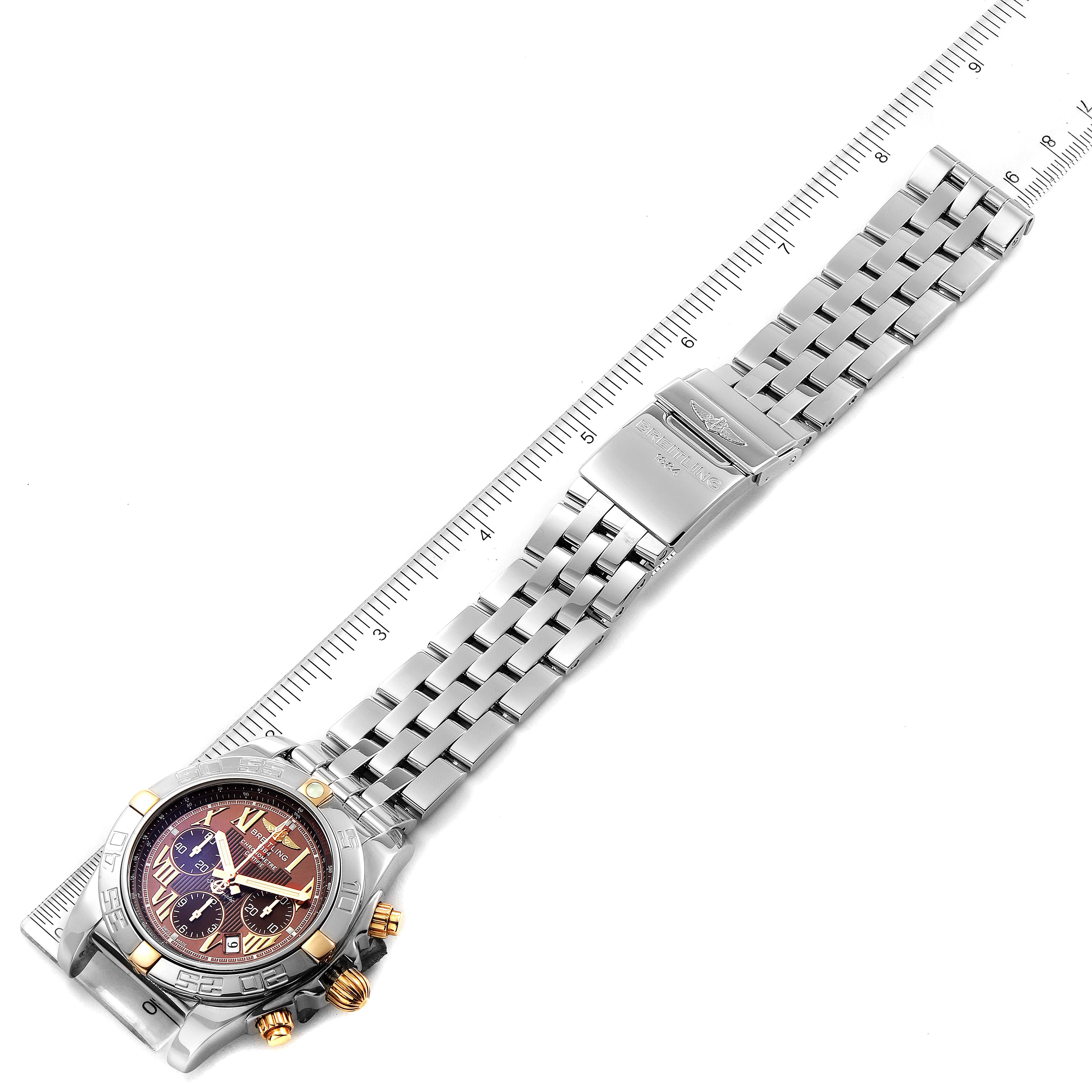 This image shows the Breitling Chronomat IB0110 Men
s Stainless Steel Brown Dial IB0110 Men
s Stainless Steel Brown Dial watch laid flat with its stainless steel bracelet and clasp fully visible.