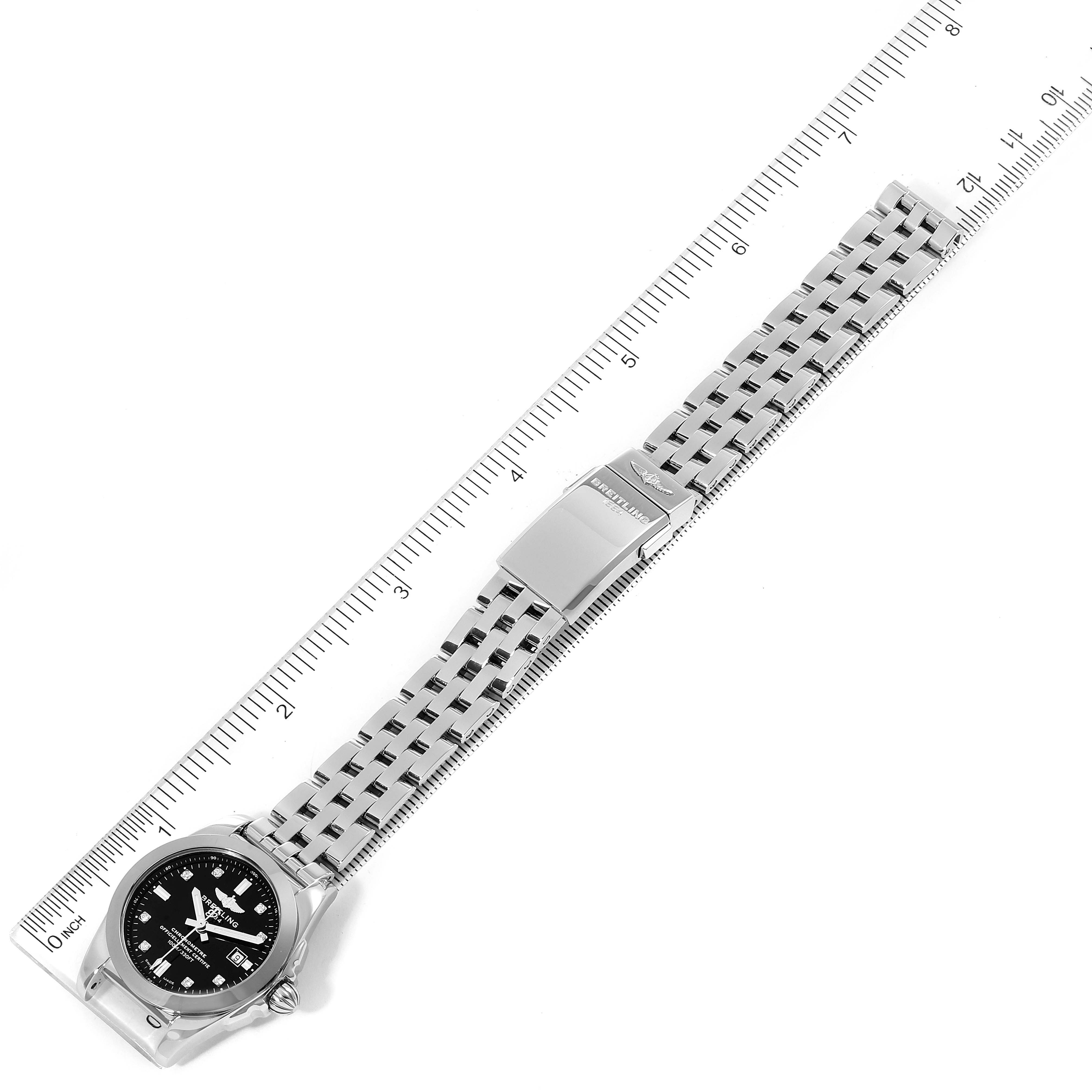 The Breitling W72348 Women's Stainless Steel Black Dial W72348 Women's Stainless Steel Black Dial Galactic 29 Diamond Dial Steel Ladies Watch W72348 is shown fully extended, with the face, bracelet, and clasp visible alongside a ruler.