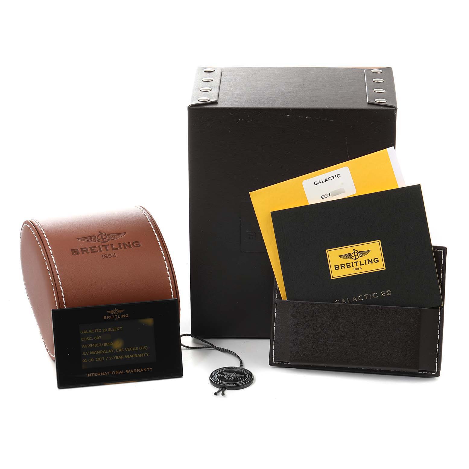 The image shows the box, warranty card, booklet, and other packaging parts of a Breitling W72348 Women's Stainless Steel Black Dial W72348 Women's Stainless Steel Black Dial Galactic 29 Diamond Dial Steel Ladies Watch W72348.
