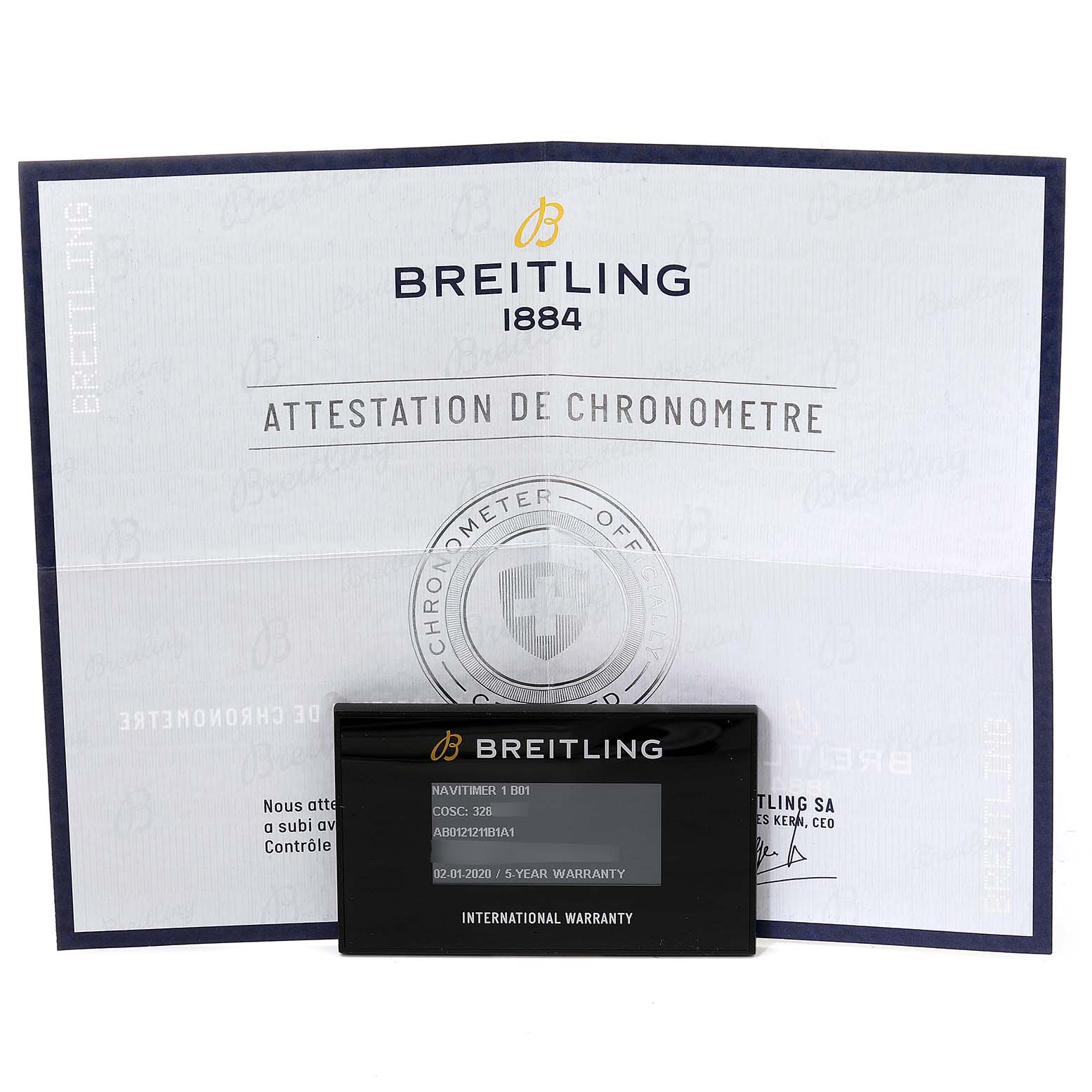 The image shows a Breitling Navitimer AB0121 Men
s Stainless Steel Black Dial AB0121 Men
s Stainless Steel Black Dial model warranty card and the chronometer certification document.