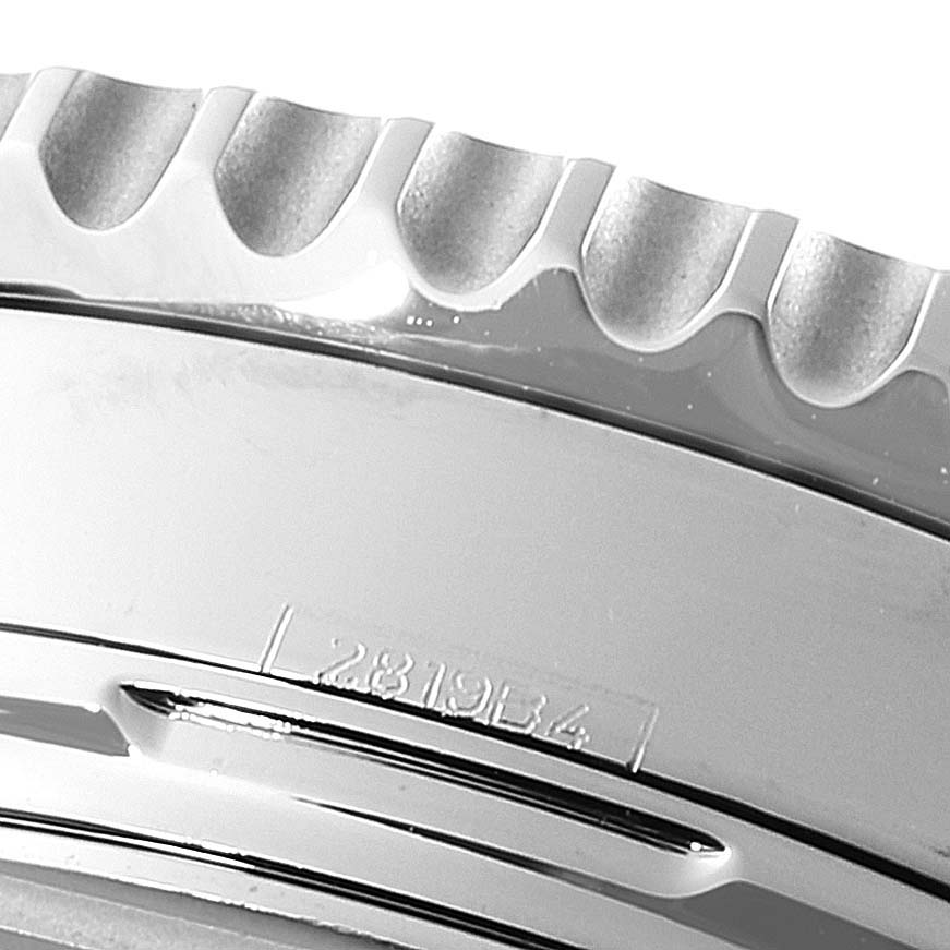 The image shows a close-up angle of the bezel and part of the case of a Breitling Navitimer AB0121 Men
s Stainless Steel Black Dial AB0121 Men
s Stainless Steel Black Dial watch, with detailed engravings visible.