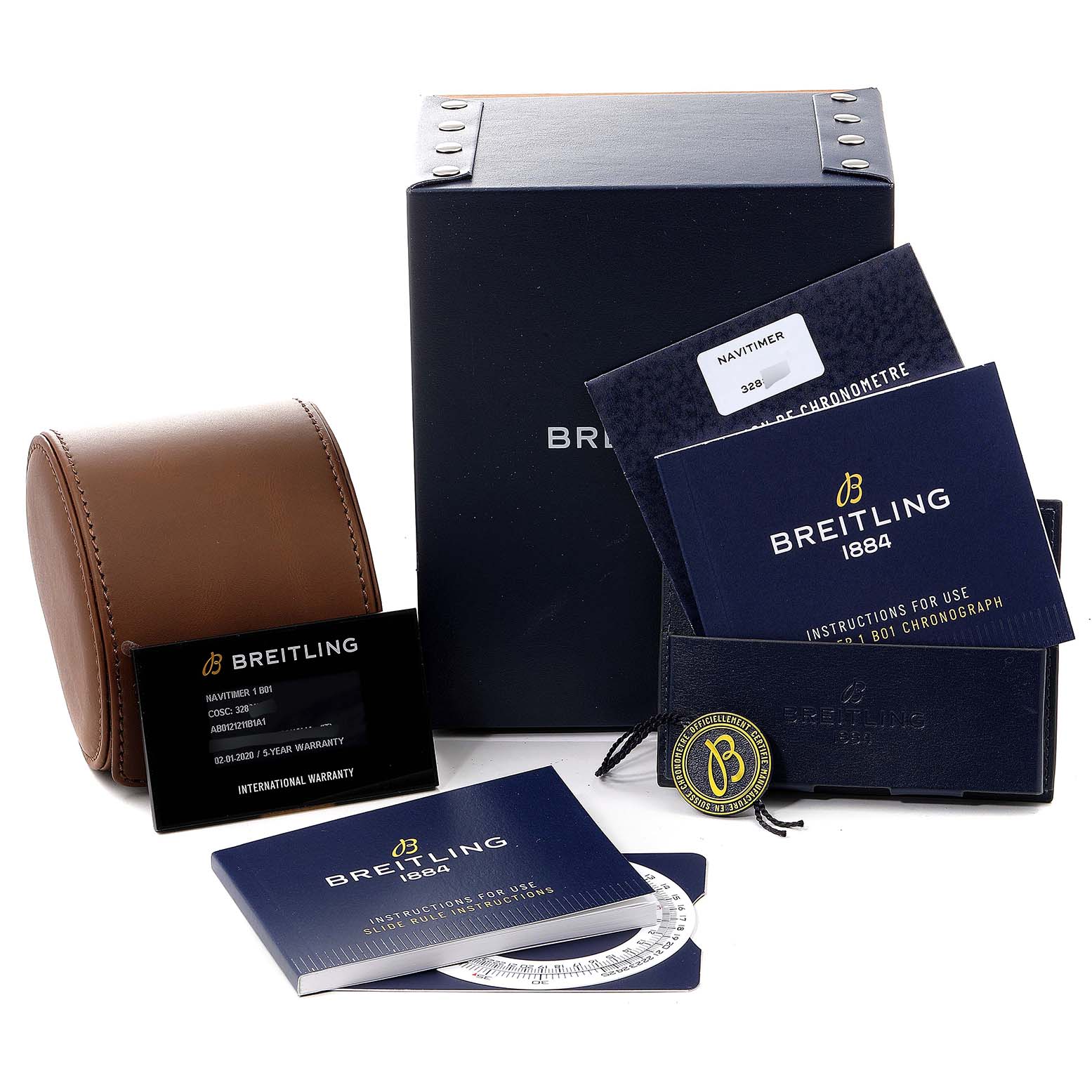 This image shows the Breitling Navitimer AB0121 Men
s Stainless Steel Black Dial AB0121 Men
s Stainless Steel Black Dial watch box, warranty card, manuals, and a leather watch case from a frontal angle.