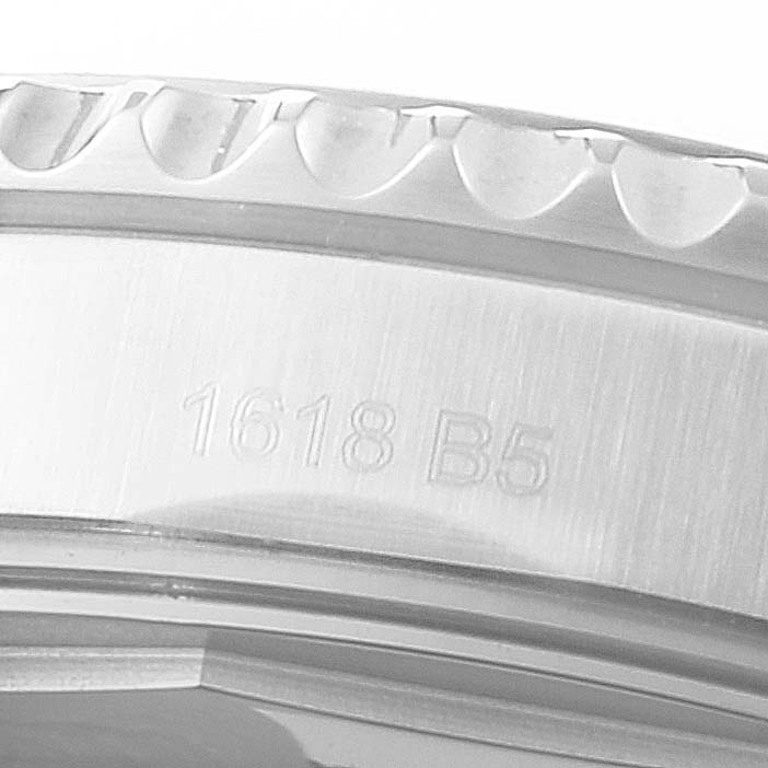 The close-up image shows the etched serial number and fluted bezel edge of a Breitling Navitimer A17314 Men
s Stainless Steel Black Dial A17314 Men
s Stainless Steel Black Dial watch.