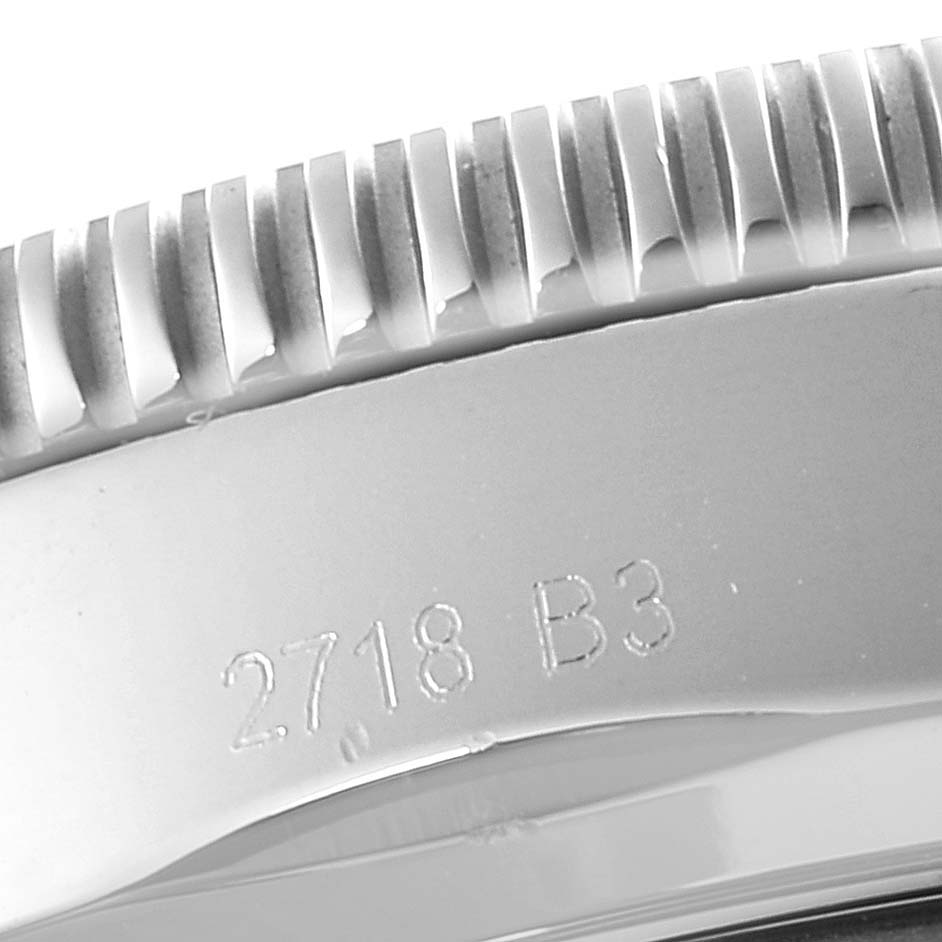 This close-up image shows the engraved edge and part of the bezel of a Breitling Superocean AB202016-C961-152A Men's Stainless Steel Blue Dial AB202016-C961-152A Men's Stainless Steel Blue Dial watch.