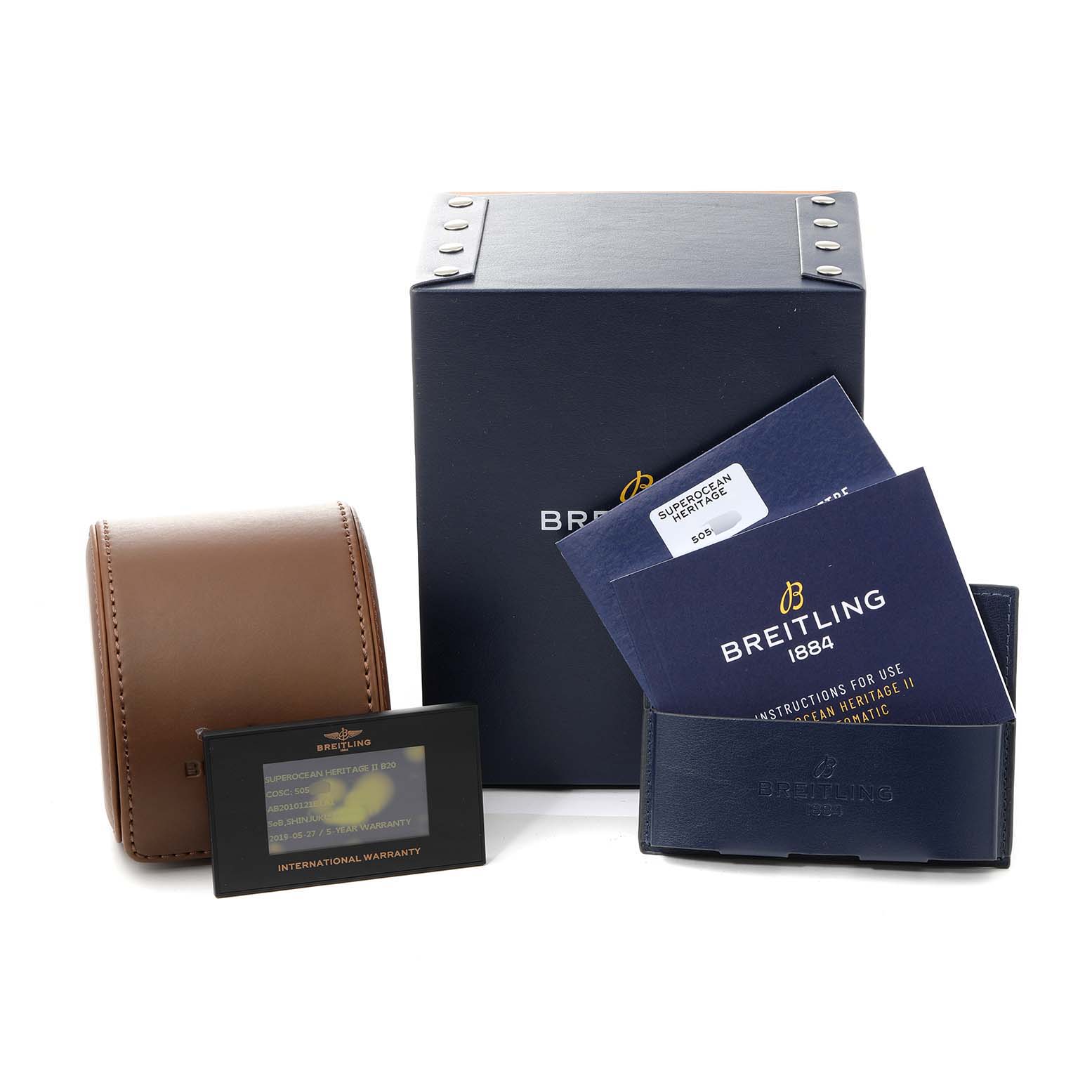 The image shows the Breitling Superocean AB2010161C1A1 Men's Stainless Steel Black Dial AB2010161C1A1 Men's Stainless Steel Black Dial watch accessories, including a box, pouch, warranty card, and instruction manuals.