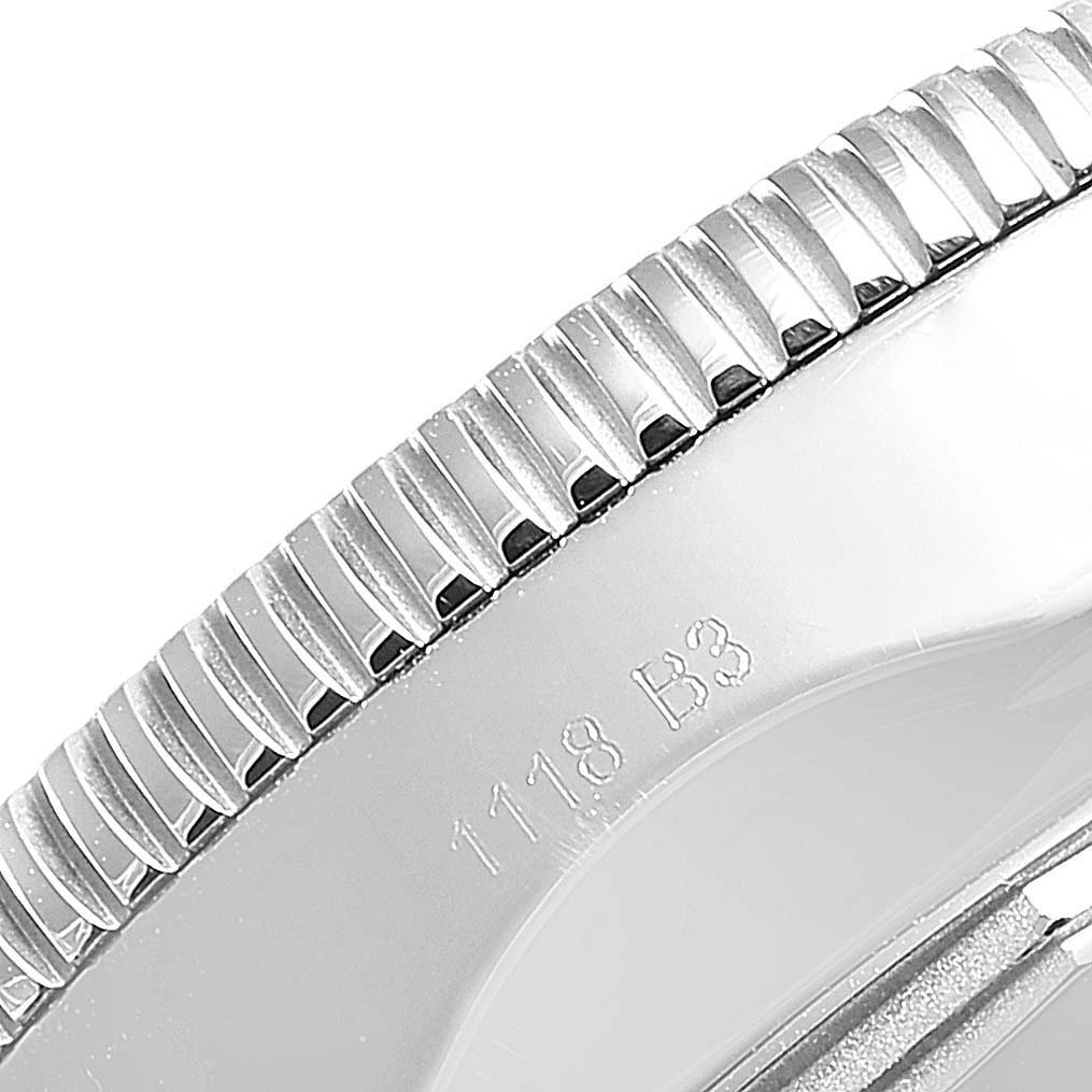 The image shows a close-up of the bezel and engraving on the side of the Breitling Superocean AB2010161C1A1 Men's Stainless Steel Blue Dial AB2010161C1A1 Men's Stainless Steel Blue Dial watch.