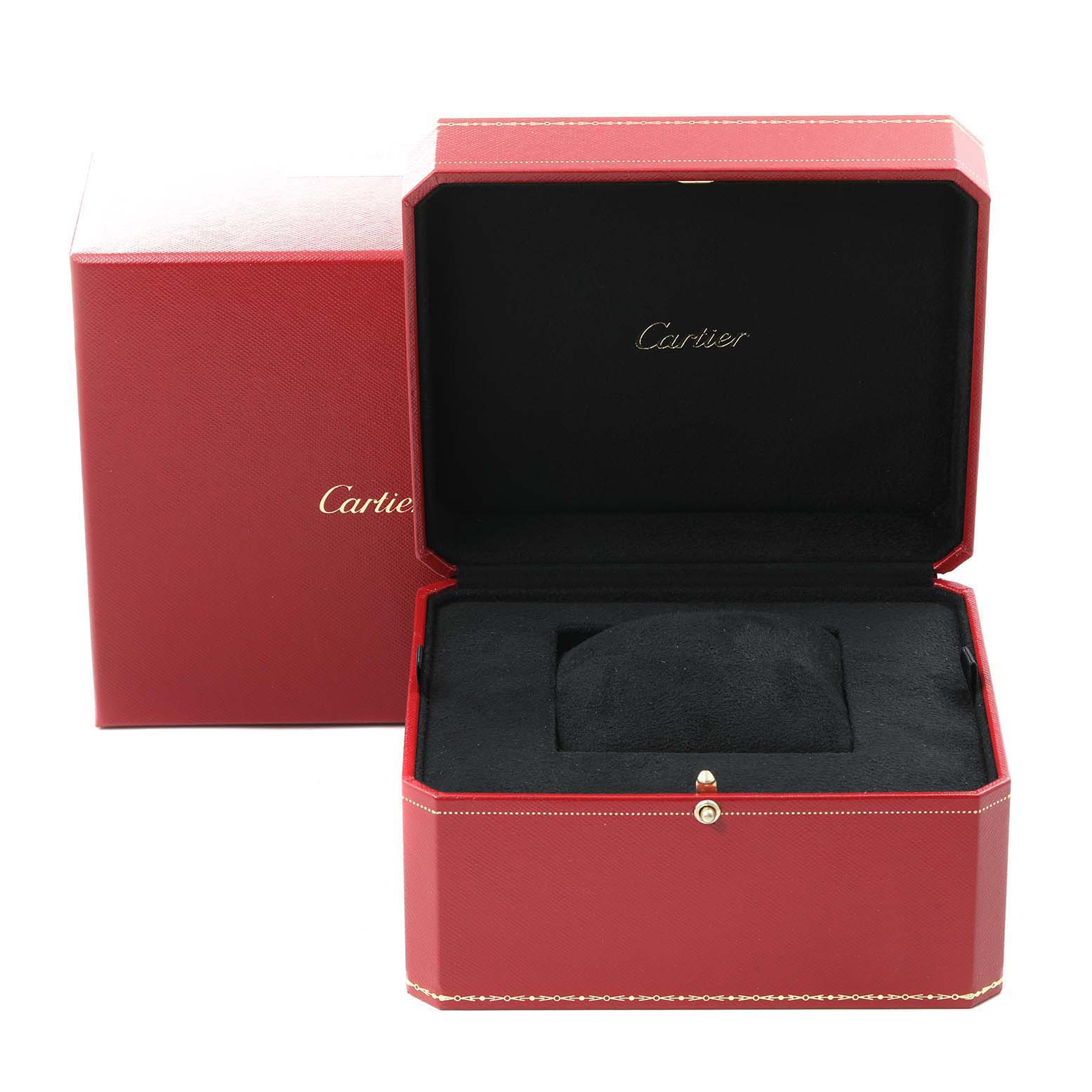 The image shows an open red Cartier Calibre de Cartier W7100016 Men
s Stainless Steel Black Dial W7100016 Men
s Stainless Steel Black Dial watch box and an outer box with the Cartier logo.