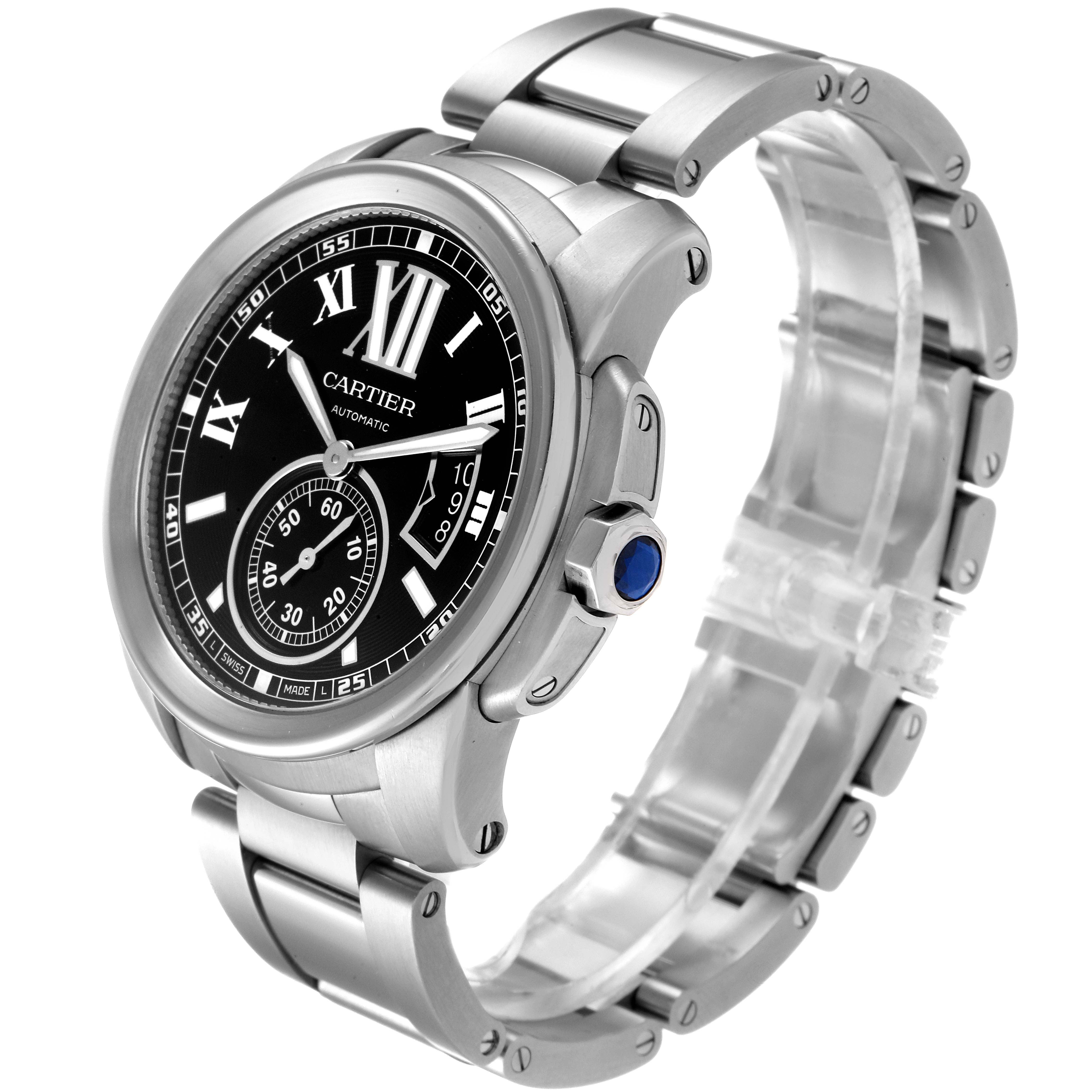 The Calibre de Cartier watch by Cartier is shown at a slight angle, displaying the face, crown, and metal bracelet.