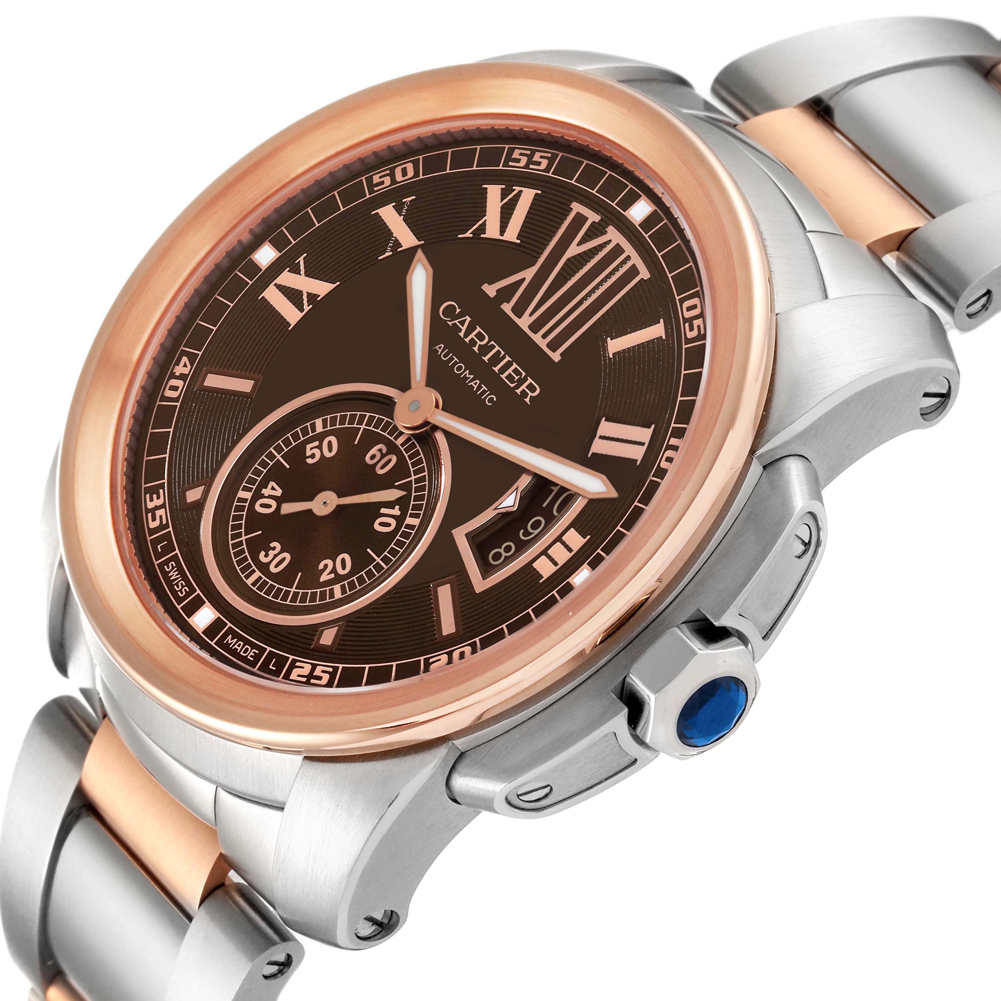 The image shows a close-up angled view of the face and bracelet of the Calibre de Cartier model by Cartier, highlighting its intricate design.