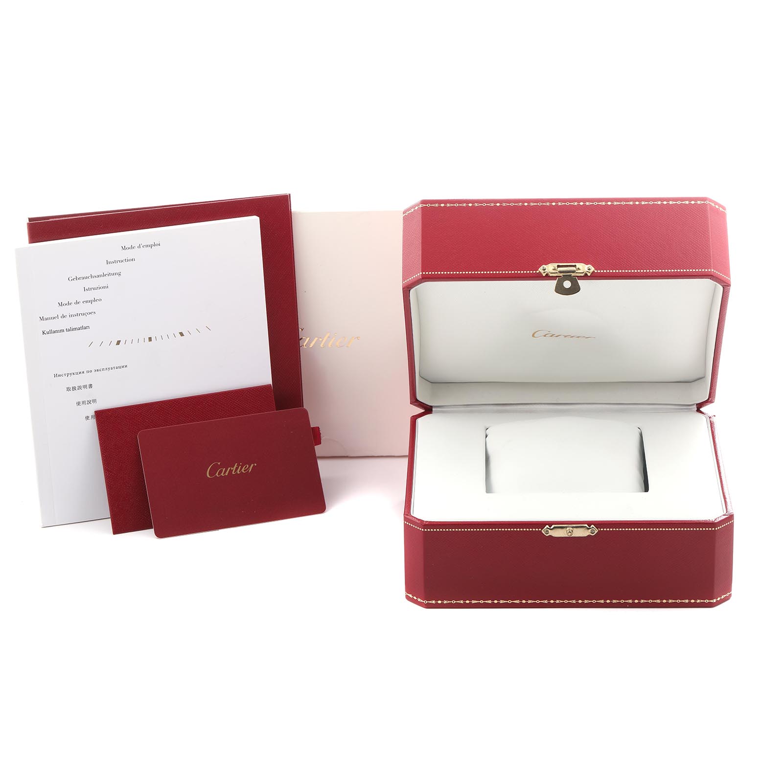 The image shows the packaging and manuals for a Calibre de Cartier watch, including a red box and documentation.