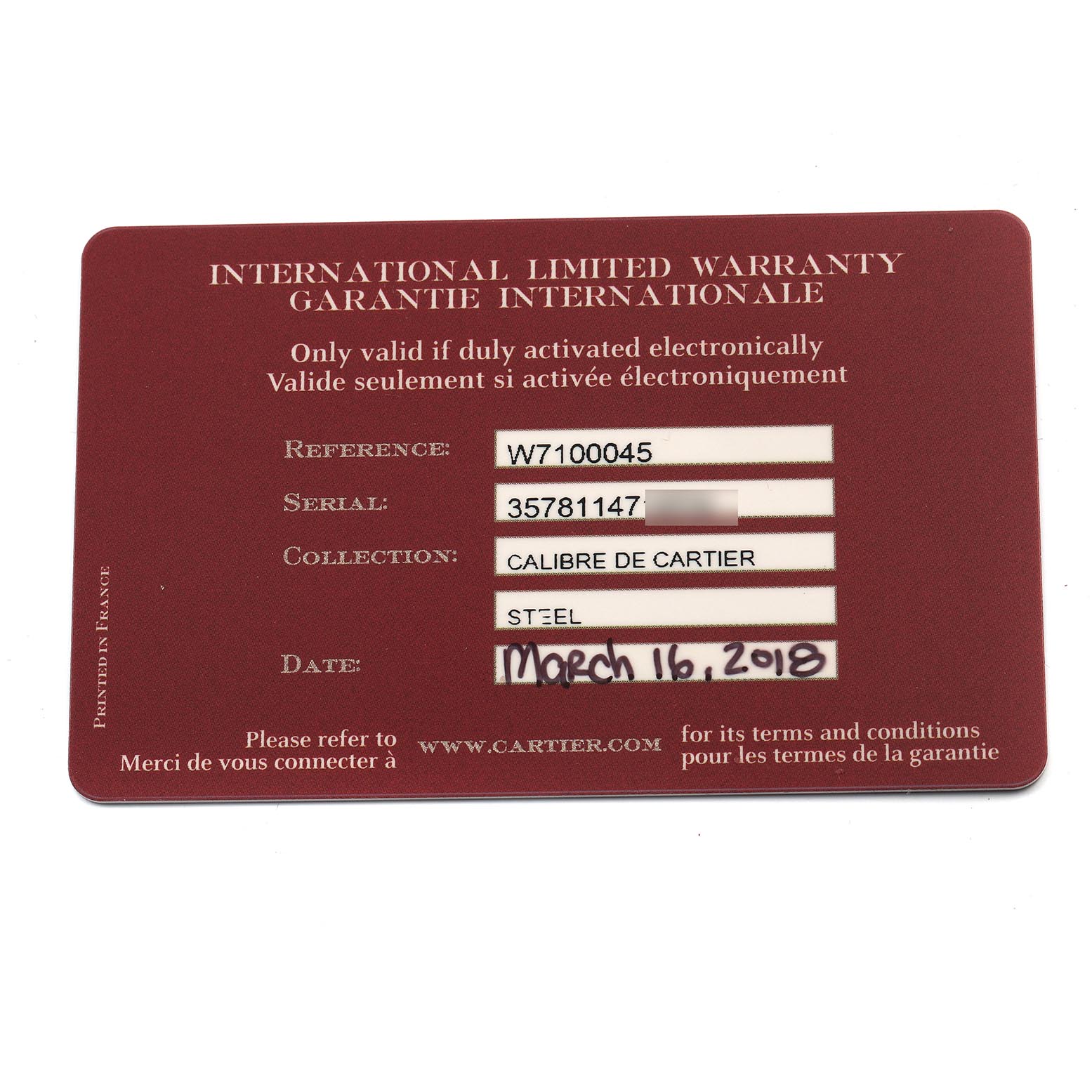This image shows the International Limited Warranty card for the Calibre de Cartier watch by Cartier, detailing reference and serial numbers.