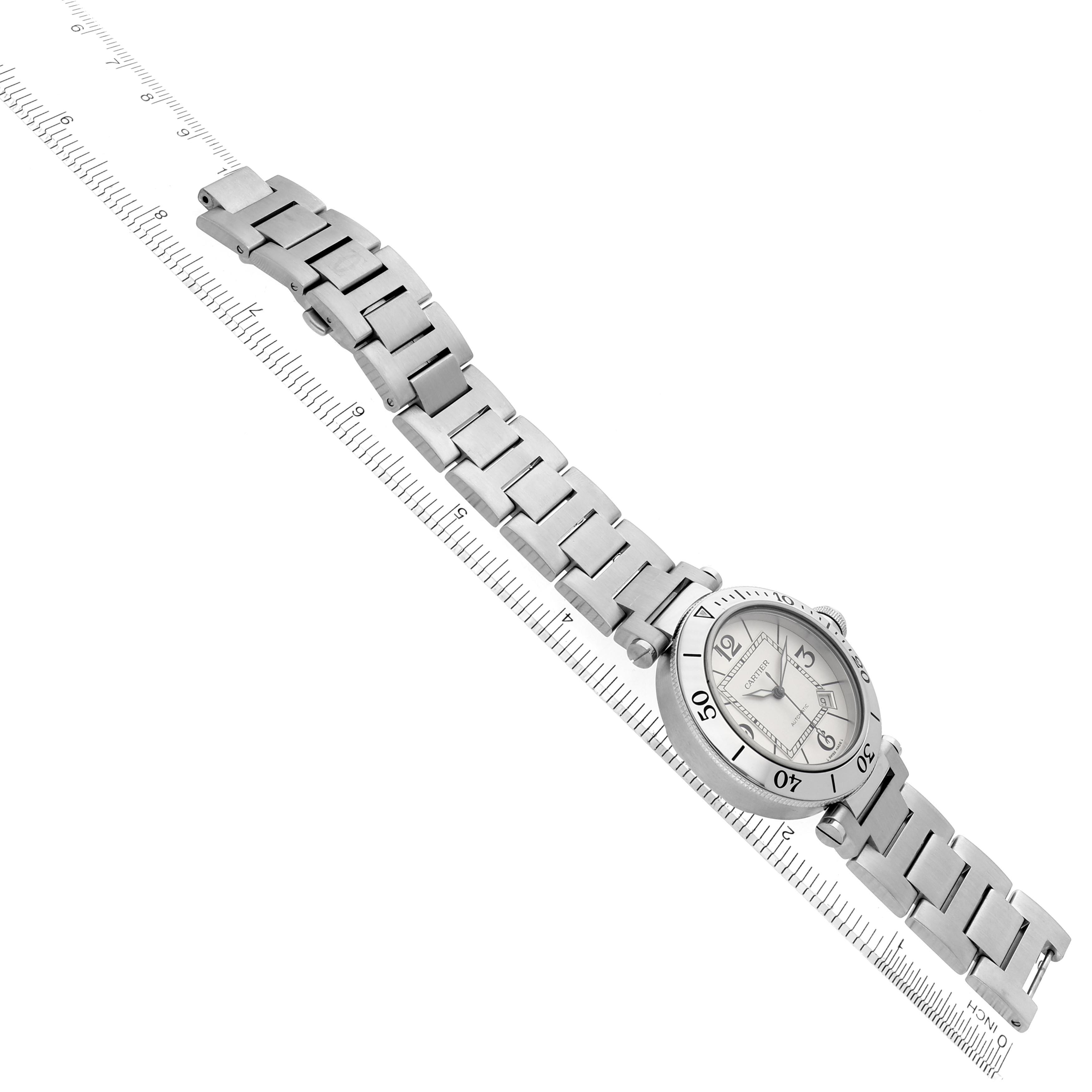 The Cartier Pasha W31080M7 Men
s Stainless Steel Silver Dial W31080M7 Men
s Stainless Steel Silver Dial watch is shown from an angled overhead view, highlighting its face and metal bracelet.