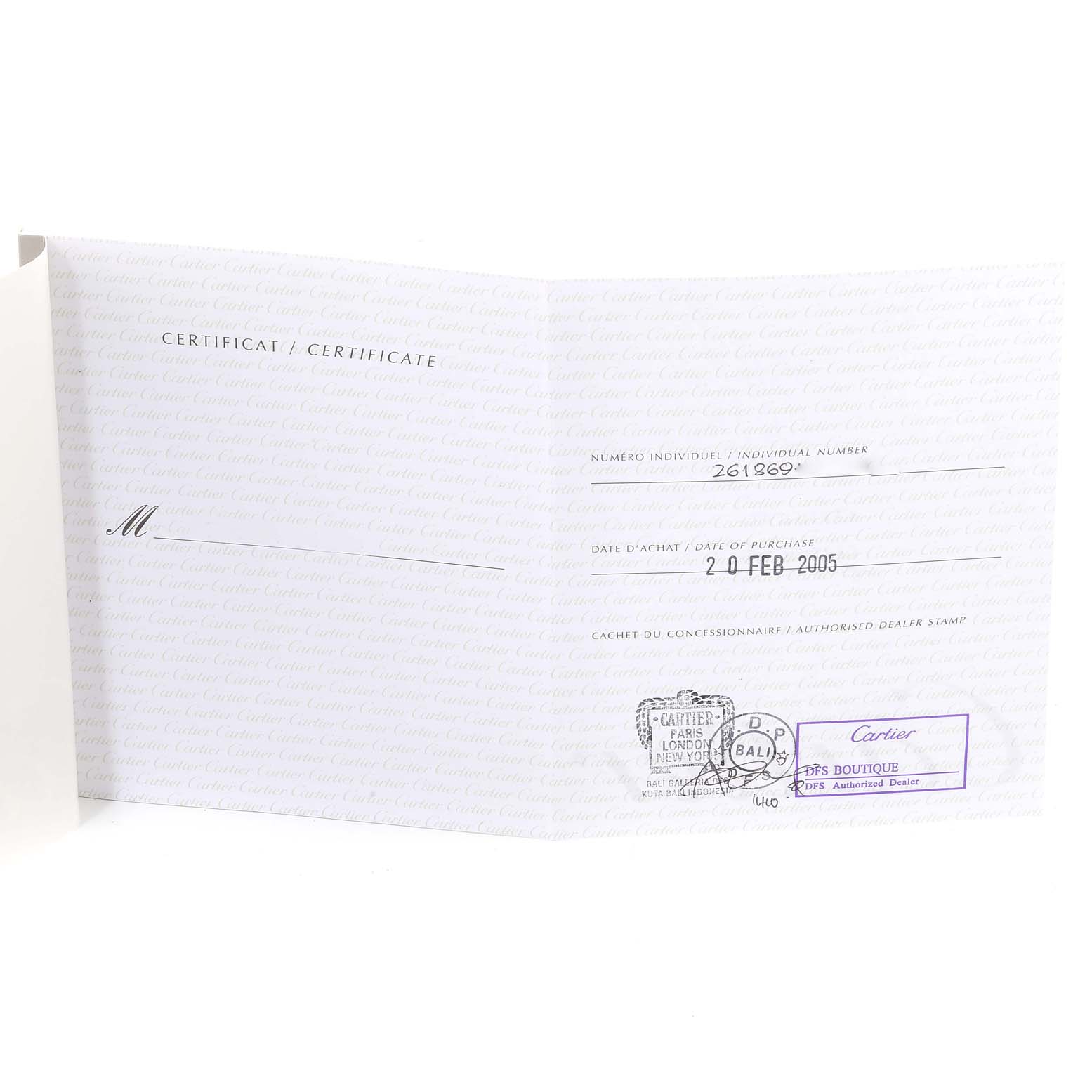 The image shows the certificate for a Cartier Roadster W62020X6 Men's Stainless Steel Black Dial W62020X6 Men's Stainless Steel Black Dial model watch at an angle revealing text and stamps.