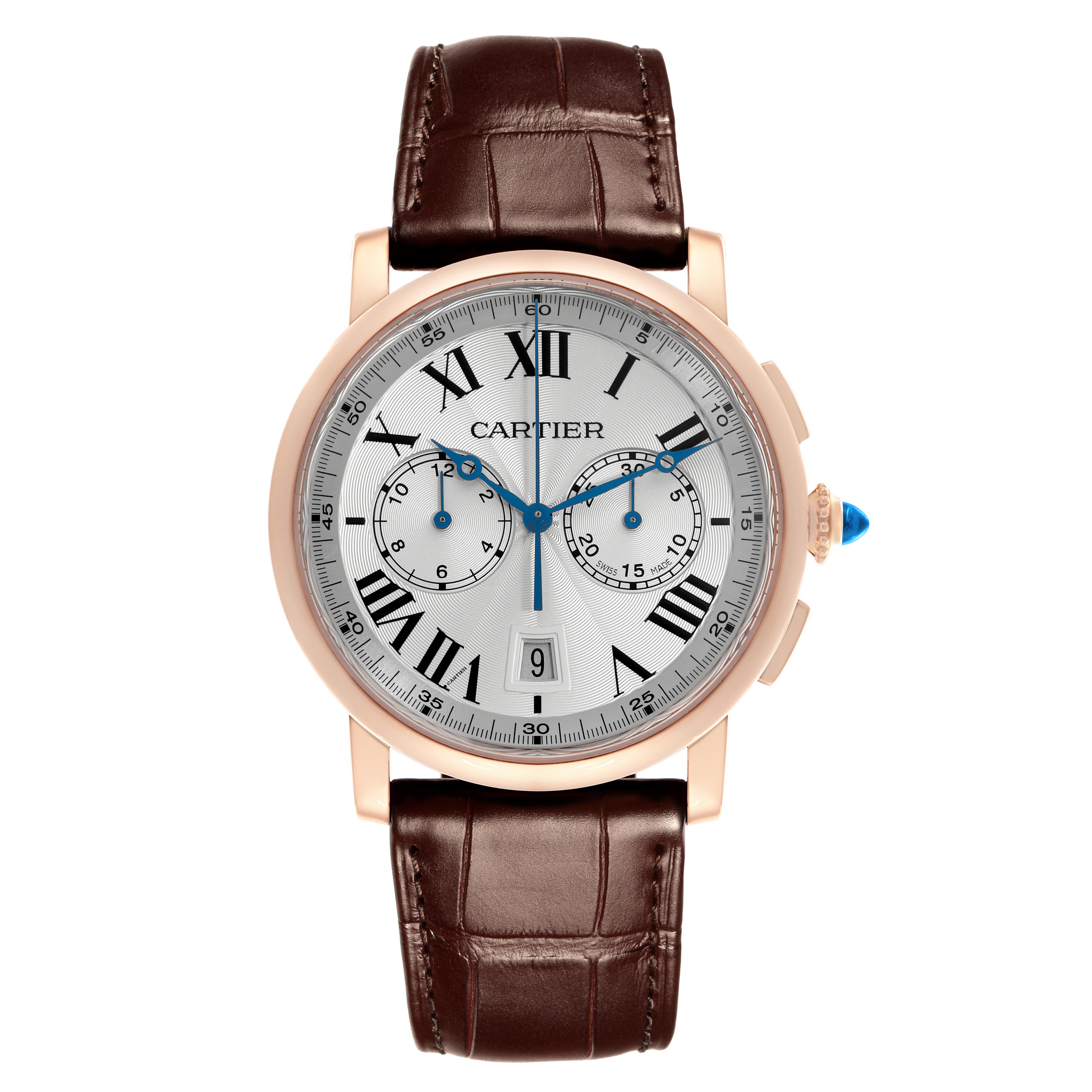 The Cartier Rotonde W1556238 Men
s Rose Gold Silver Dial W1556238 Men
s Rose Gold Silver Dial watch is shown from the front, displaying its face, dial, and brown leather strap.
