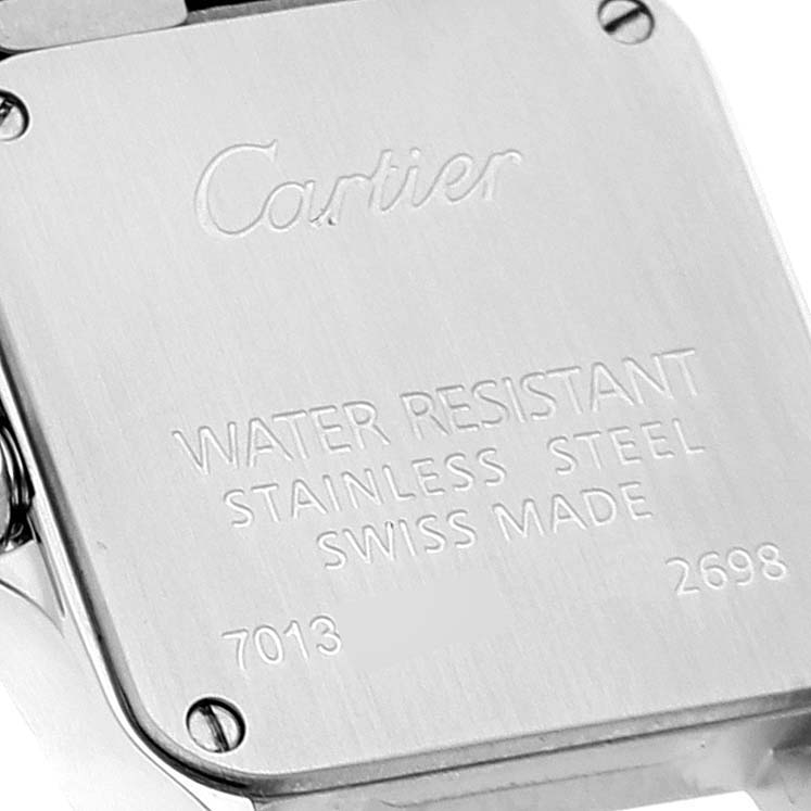 This image shows the back case of a Santos Demoiselle model by Cartier, including its engravings and screws.