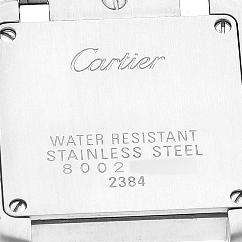 This image shows the case back of a Cartier Tank Française watch, highlighting its water resistance and stainless steel material.