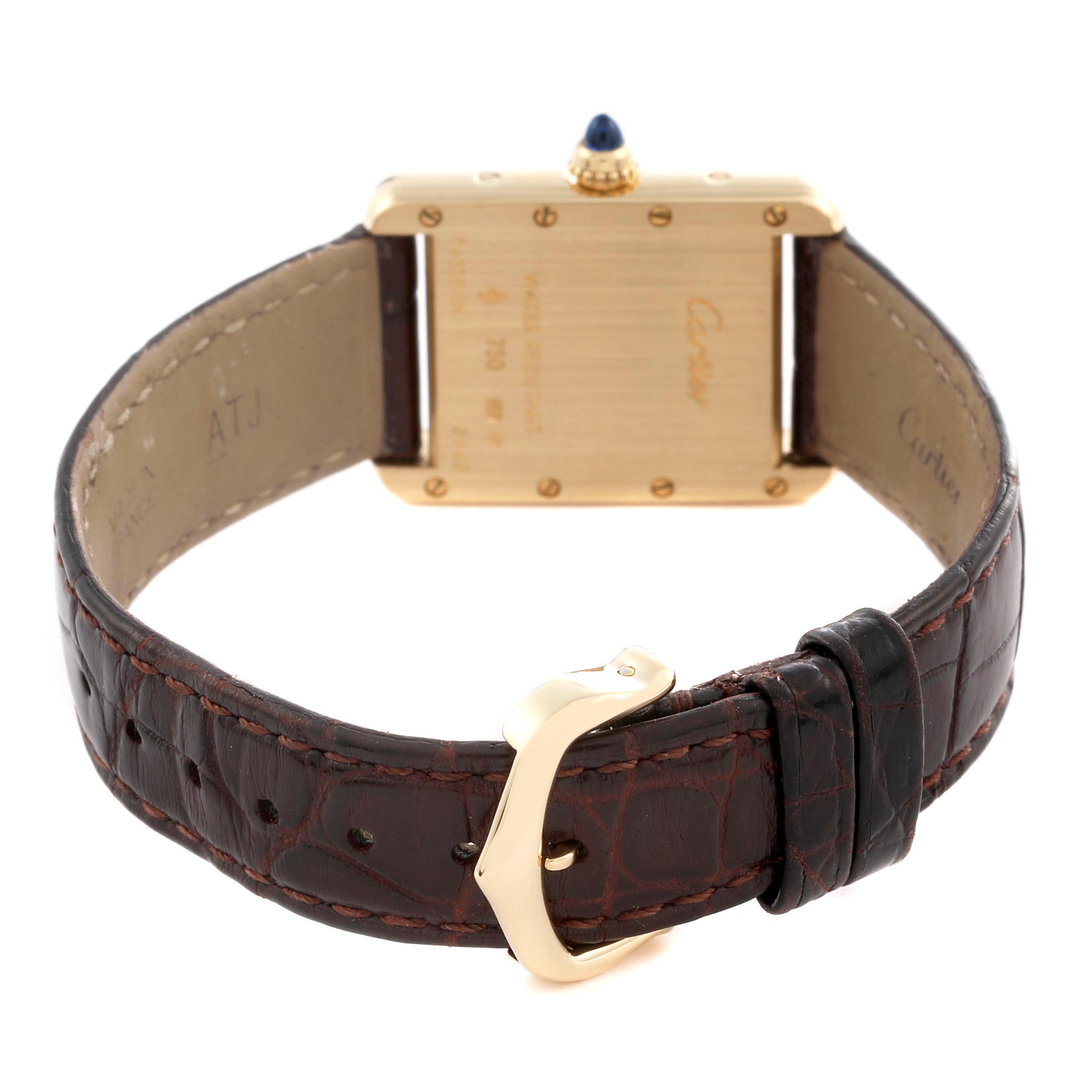 The image shows the back view of a Cartier Tank Louis W1529856 Women
s Yellow Gold Silver Dial W1529856 Women
s Yellow Gold Silver Dial watch, highlighting the case back, leather strap, buckle, and crown.