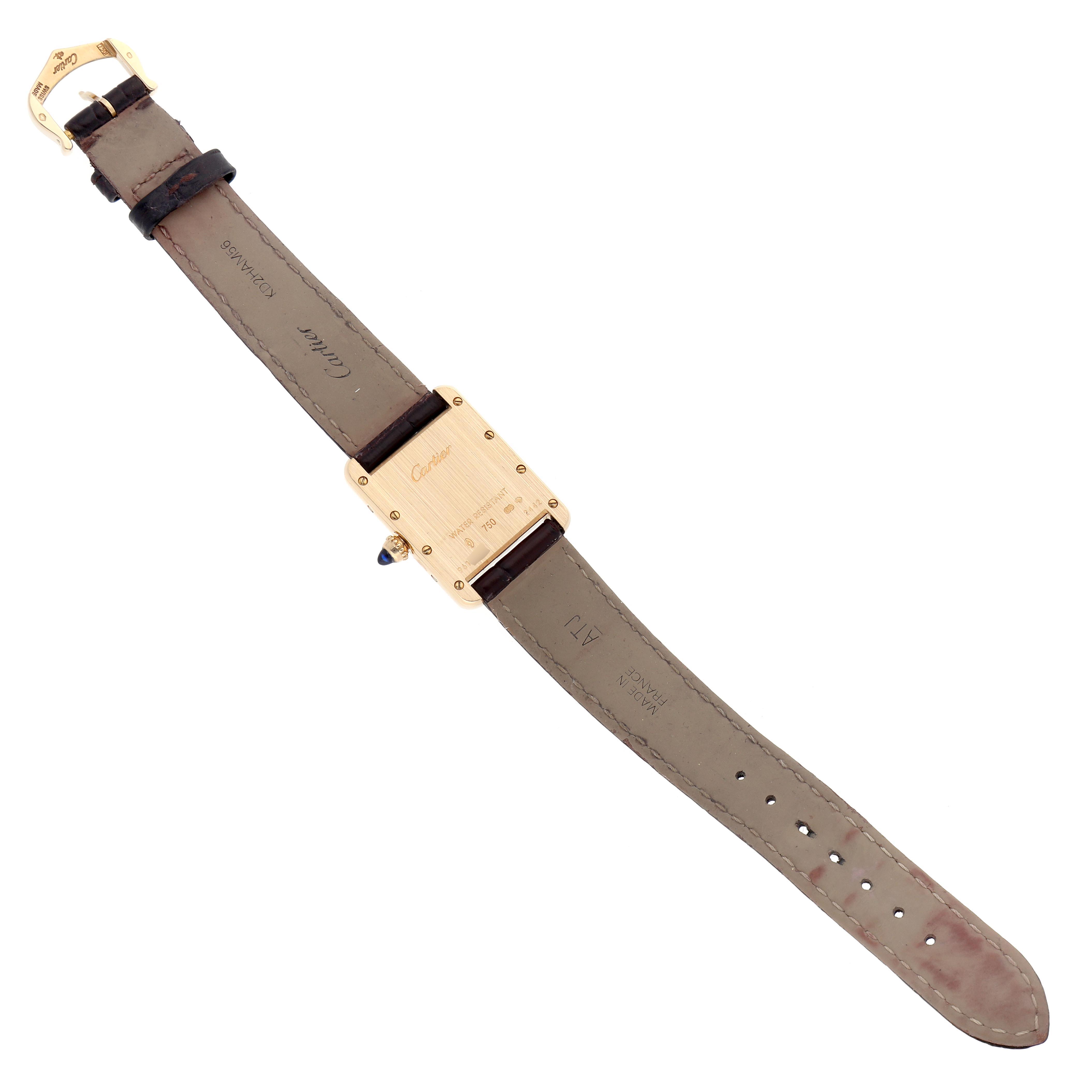 The Cartier Tank Louis W1529856 Women
s Yellow Gold Silver Dial W1529856 Women
s Yellow Gold Silver Dial model is shown from the back, displaying the case, leather strap, and buckle.