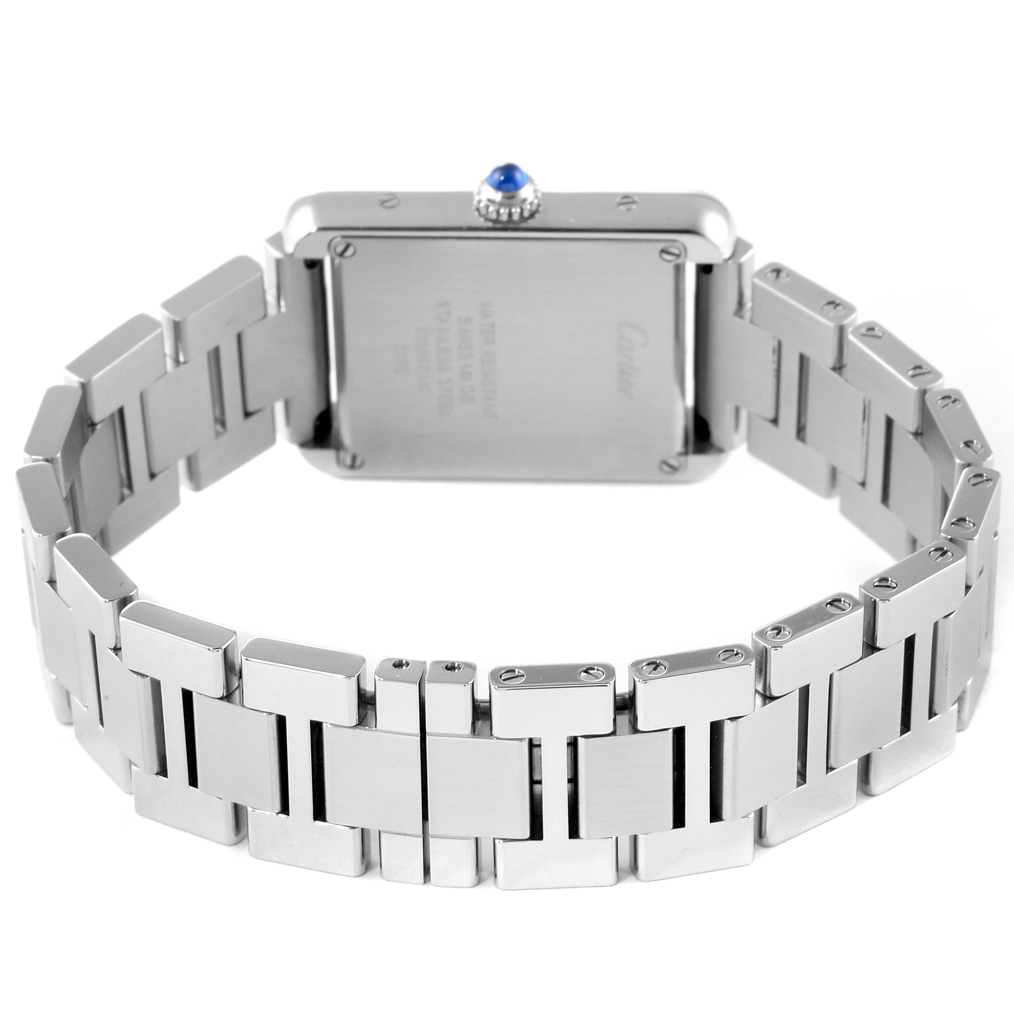 This image shows the backside and bracelet of a Cartier Tank Solo W5200013 Women's Stainless Steel Silver Dial W5200013 Women's Stainless Steel Silver Dial watch, highlighting its stainless steel case and blue cabochon crown.