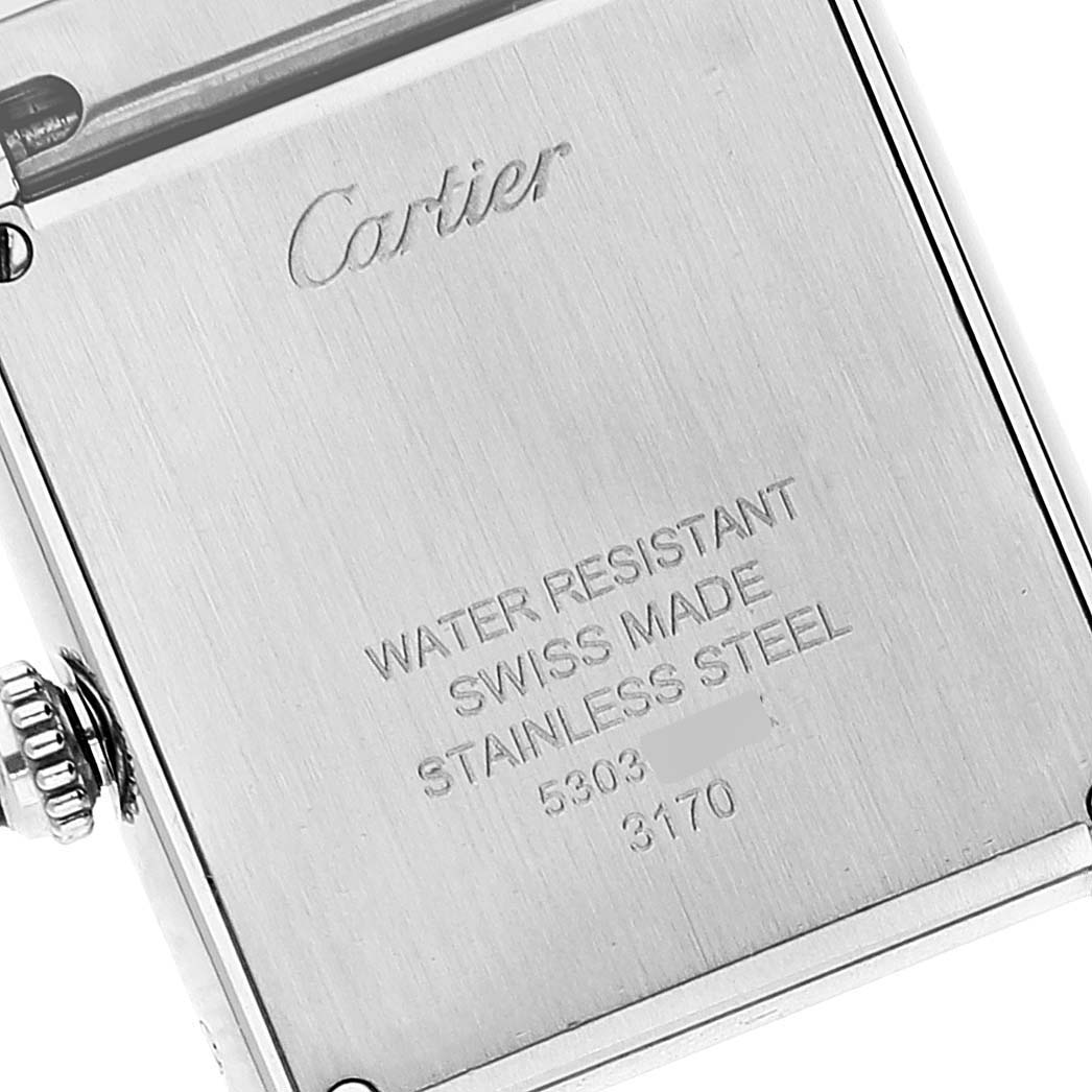 The image shows the back case and crown of a Cartier Tank Solo W5200013 Women's Stainless Steel Silver Dial W5200013 Women's Stainless Steel Silver Dial model watch, highlighting its water resistance and material details.