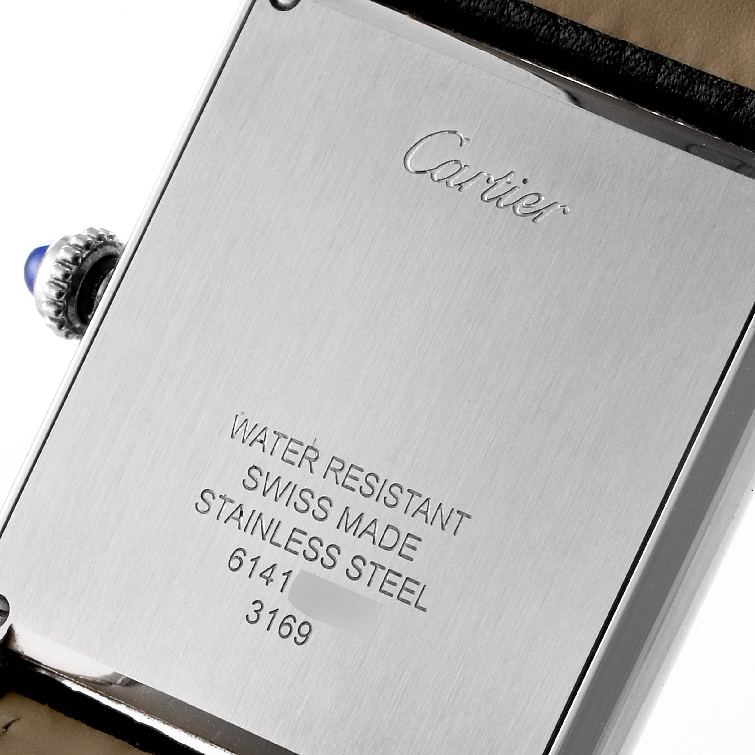 This image shows the back case and crown of the Tank Solo model by Cartier, highlighting its engravings and detailing.