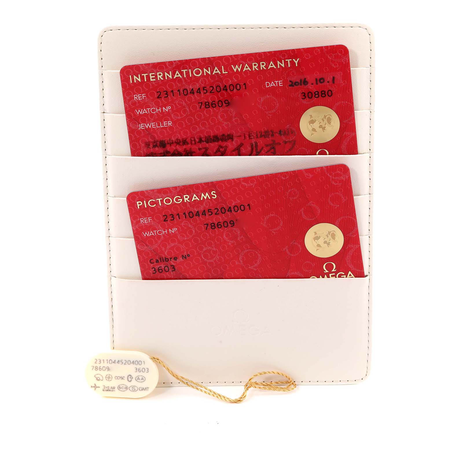 The image shows the documentation and tags for an Omega Aqua Terra 231.10.44.52.04.001 Men
s Stainless Steel White Dial 231.10.44.52.04.001 Men
s Stainless Steel White Dial watch, including warranty and pictogram cards in a holder.