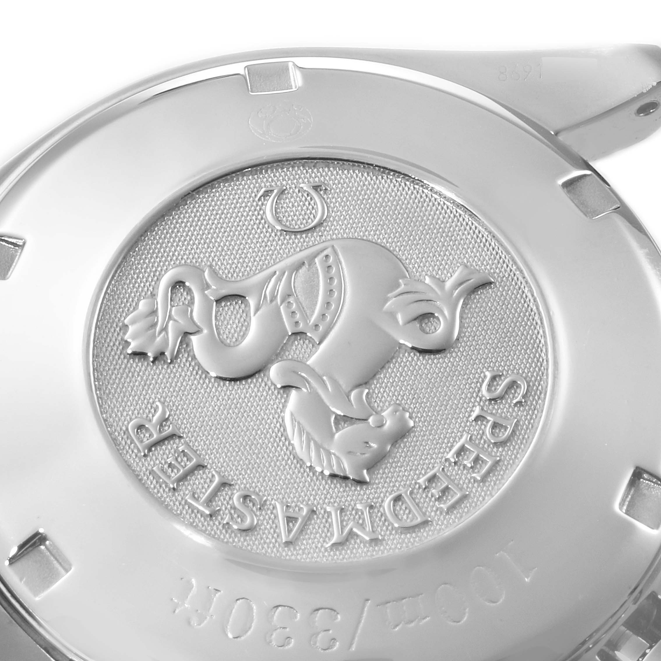 The image shows the back case of an Omega Speedmaster 3212.80.00 Men
s Stainless Steel Blue Dial 3212.80.00 Men
s Stainless Steel Blue Dial watch, featuring engraved branding and a logo.