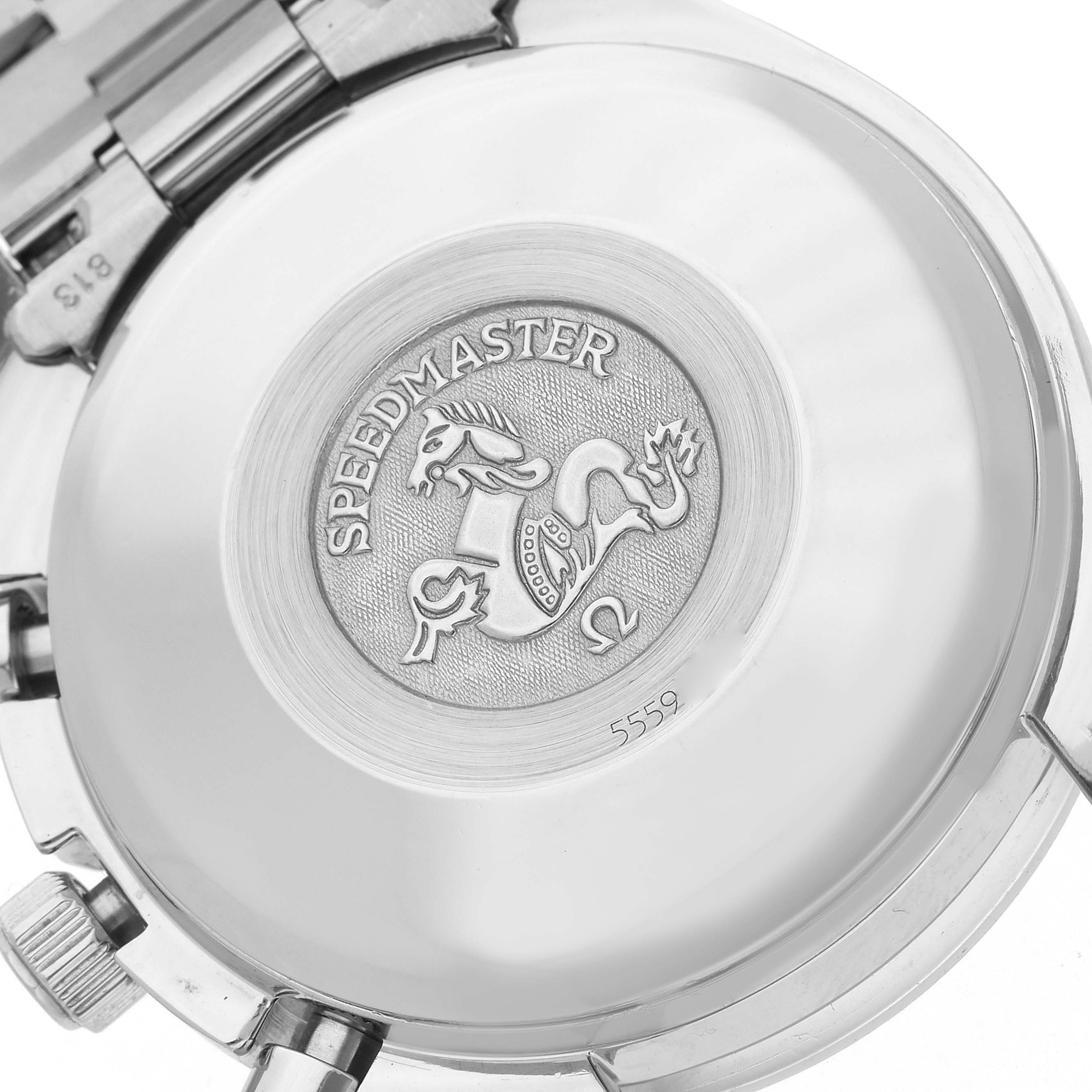 The image shows the back case of an Omega Speedmaster 3521.30.00 Men
s Stainless Steel Silver Dial 3521.30.00 Men
s Stainless Steel Silver Dial watch, featuring its engraved emblem.