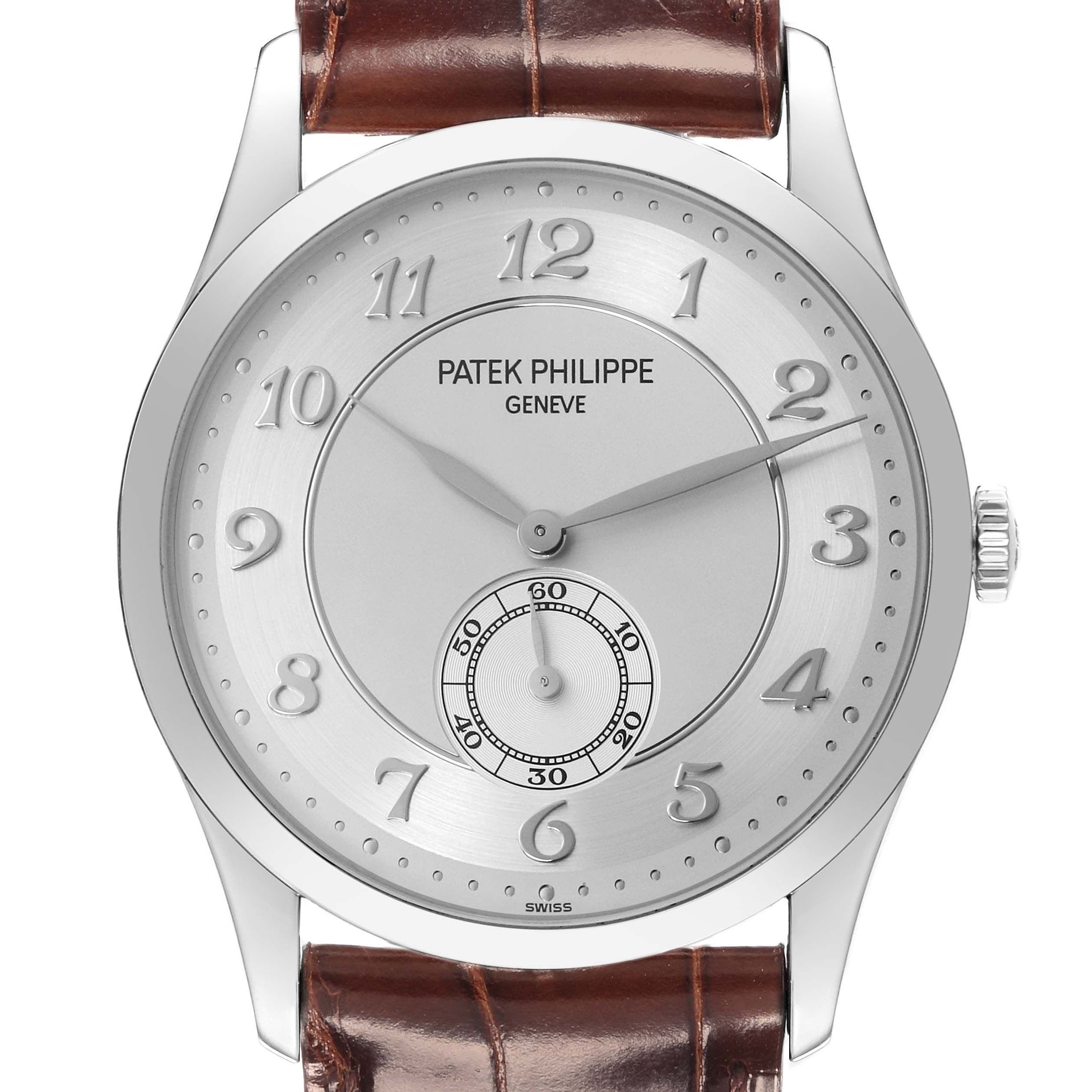 The image shows a front view of a Patek Philippe Calatrava 5196P-001 Men's Platinum Silver Dial watch, highlighting the dial and brown leather strap.