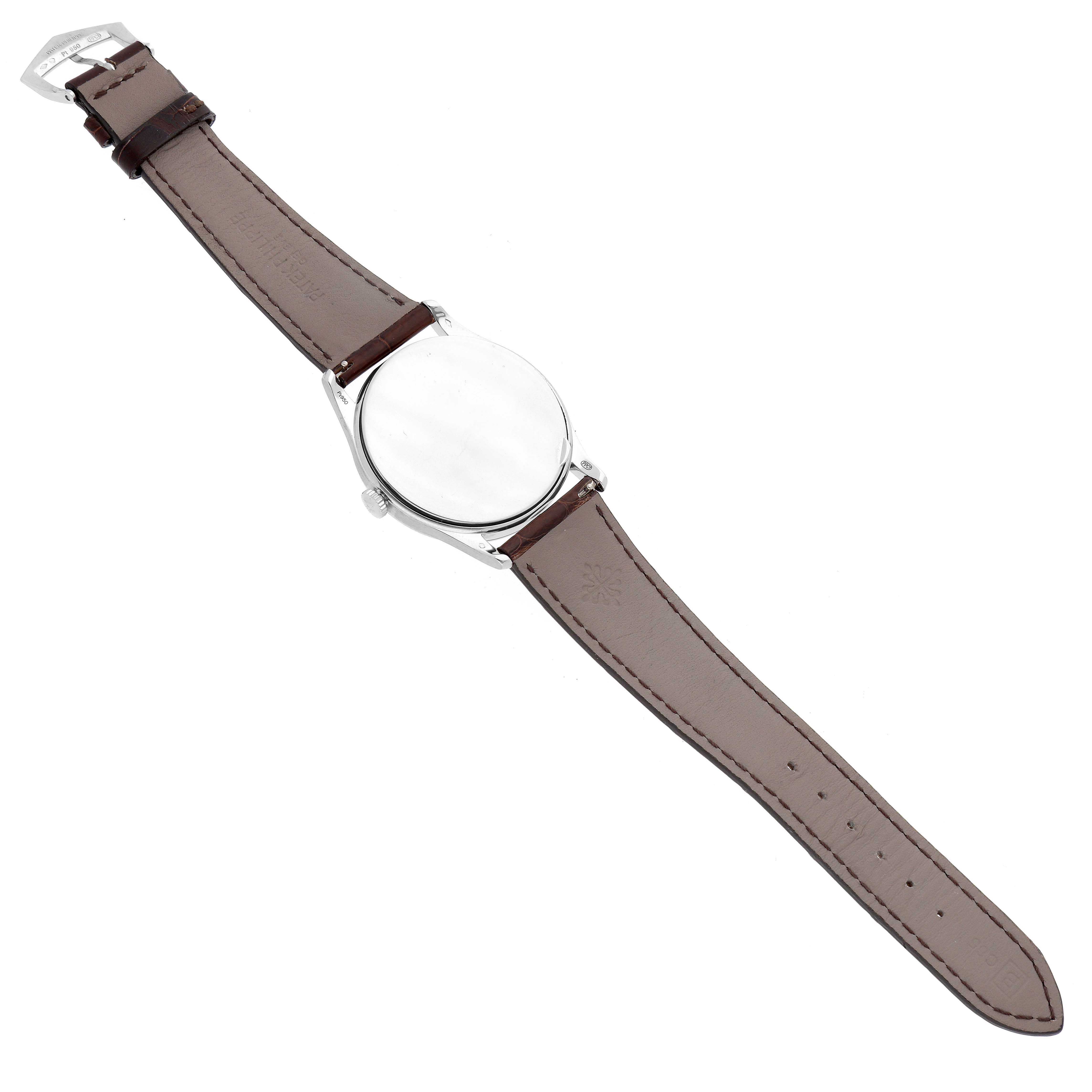 The Patek Philippe Calatrava 5196P-001 Men's Platinum Silver Dial watch is shown from the back, displaying the leather strap and the underside of the case.