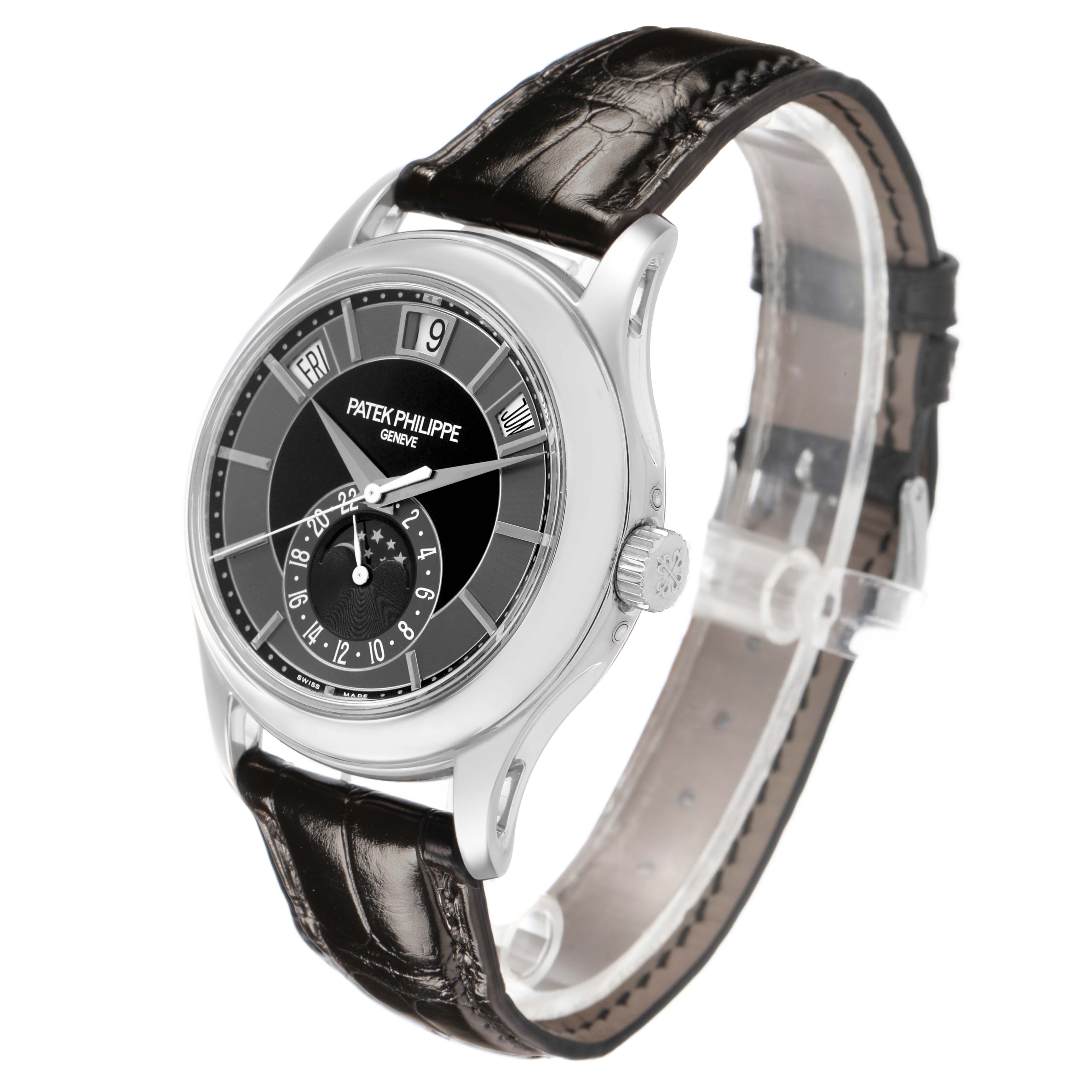 The Patek Philippe Complications 5205G-010 Men's White Gold Grey Dial watch is shown at a front-left angle, displaying the face, crown, and leather strap.
