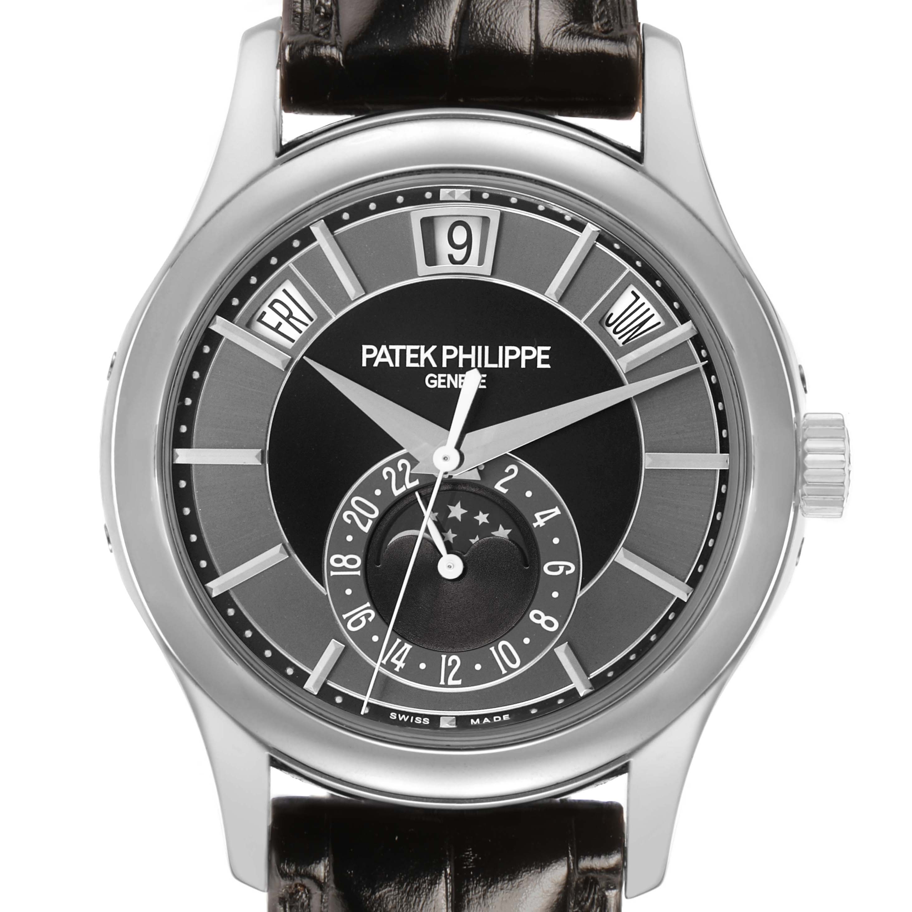The image shows a front view of the Patek Philippe Complications 5205G-010 Men's White Gold Grey Dial watch, highlighting the dial, hands, date, and day indicators.
