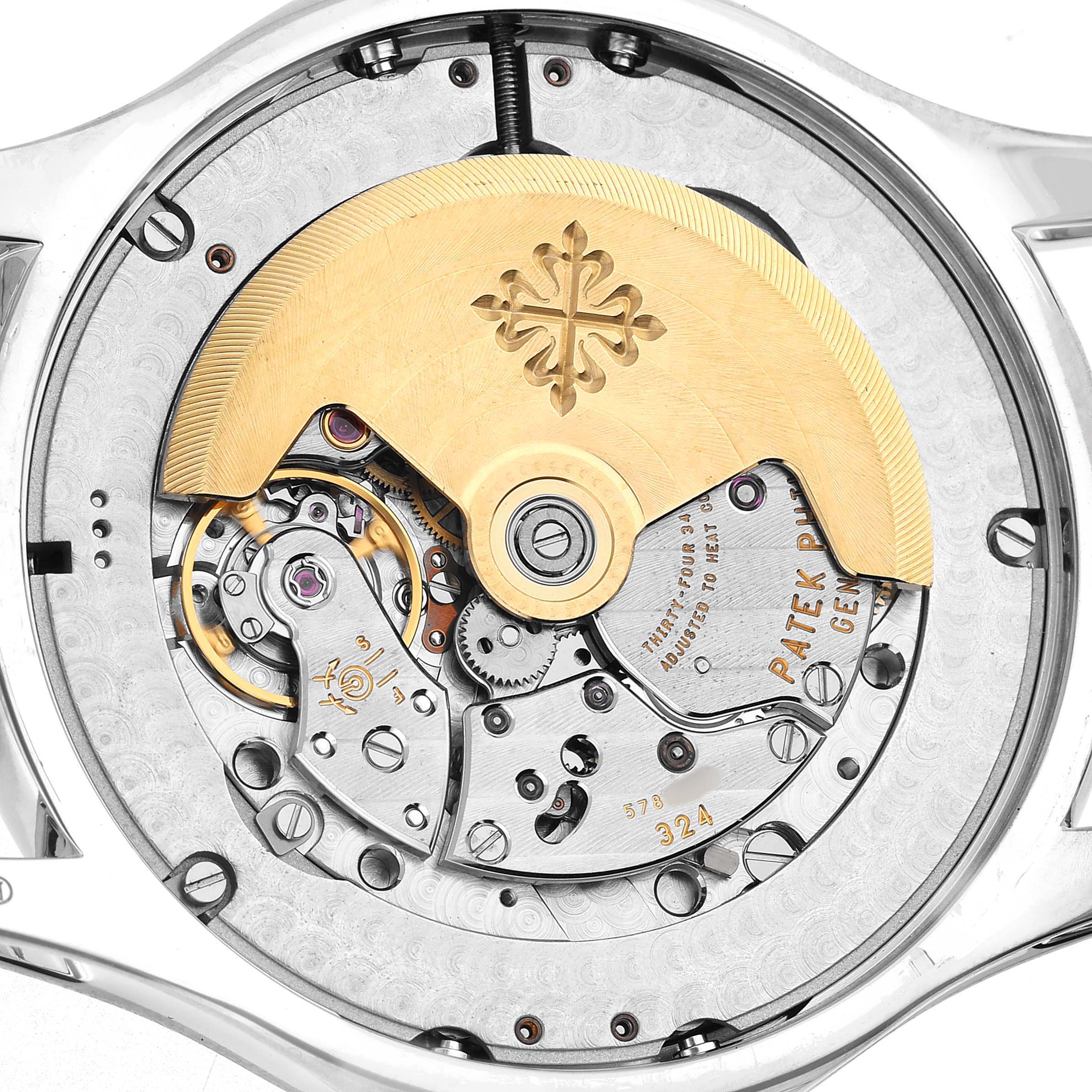 The image shows the back of a Patek Philippe Complications 5205G-010 Men's White Gold Grey Dial model, highlighting the intricate movement and rotor.