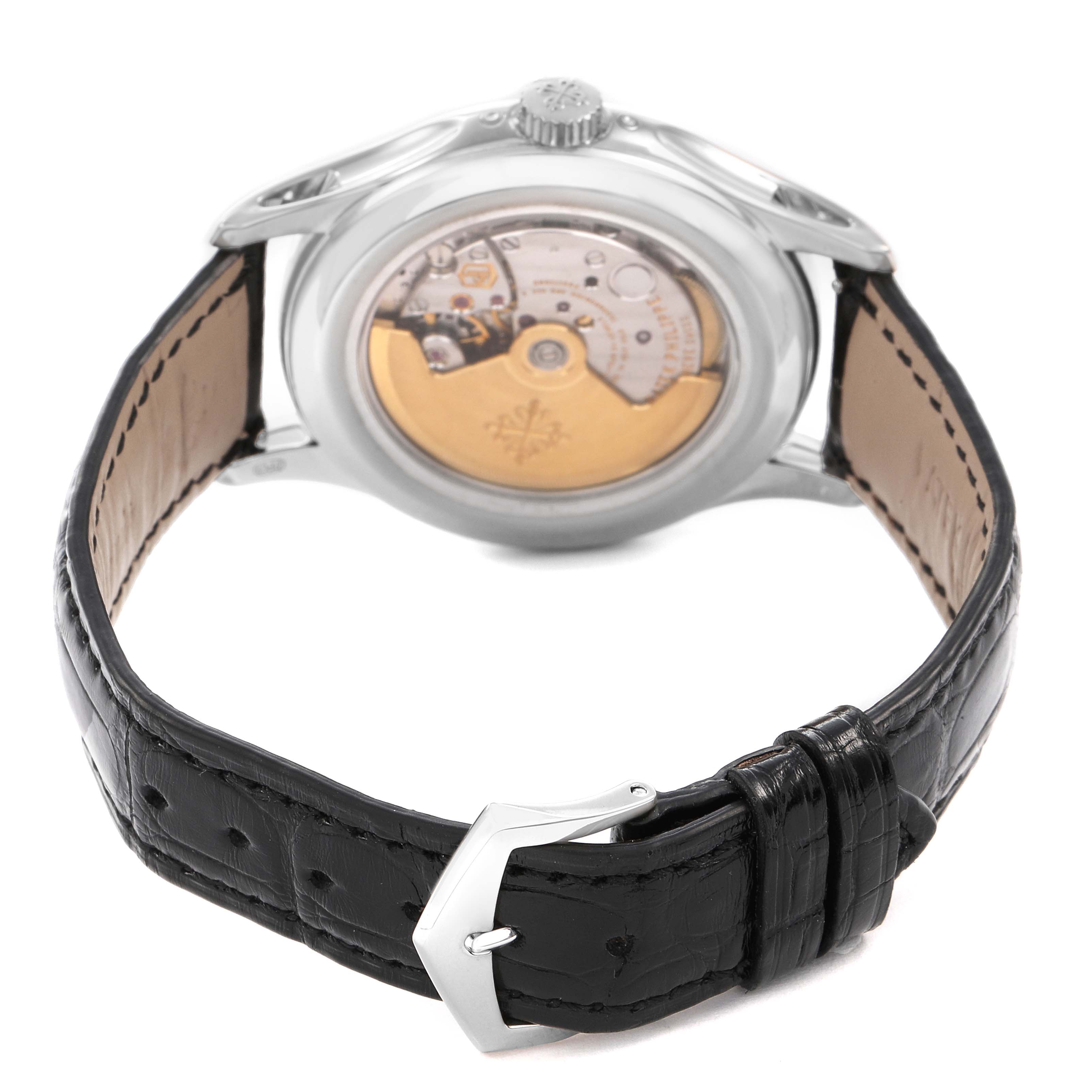 This image shows the back view of the Patek Philippe Complications 5205G-010 Men's White Gold Grey Dial watch, highlighting the movement and leather strap.