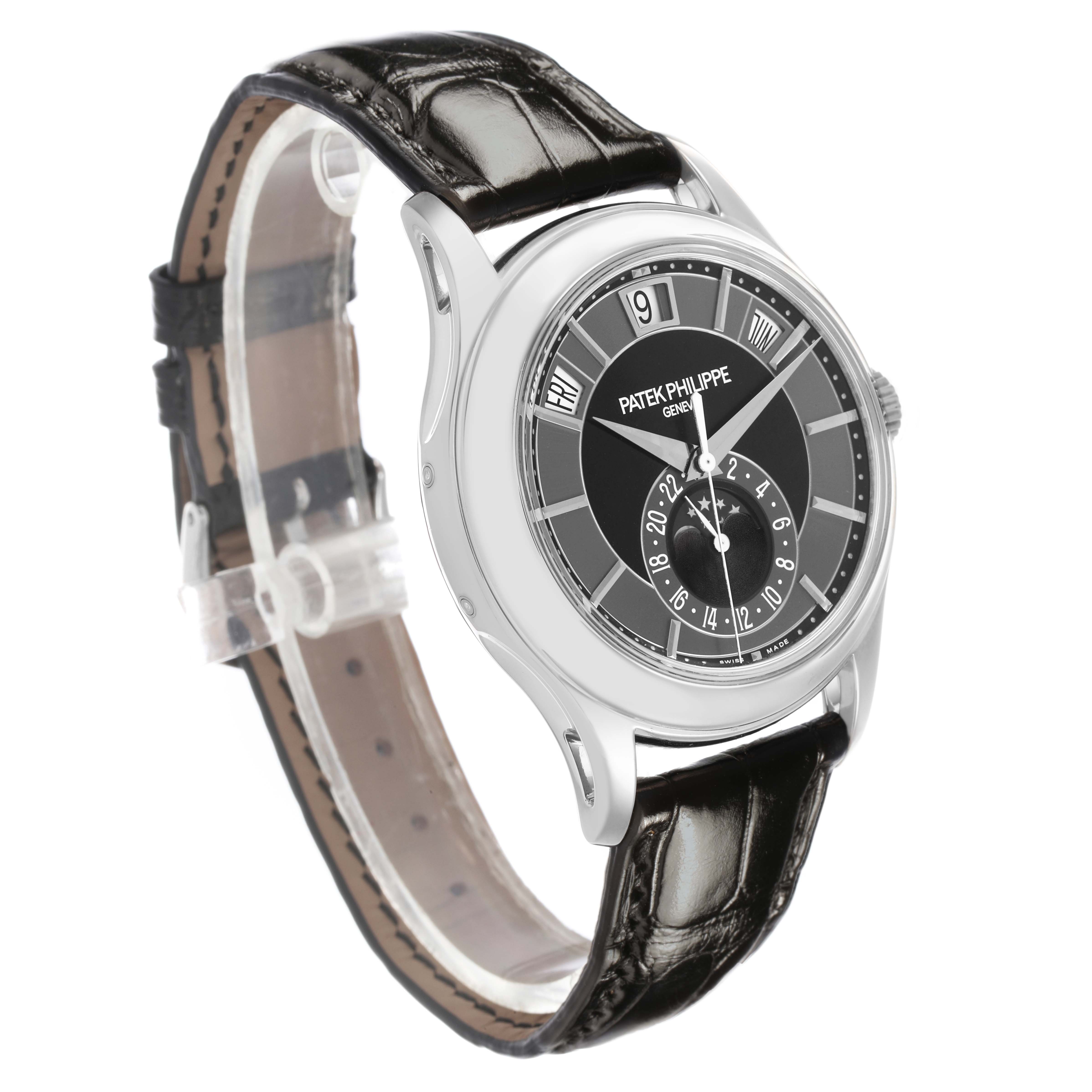 The Patek Philippe Complications 5205G-010 Men's White Gold Grey Dial watch is shown at a three-quarter angle, displaying the face, case, and strap clearly.